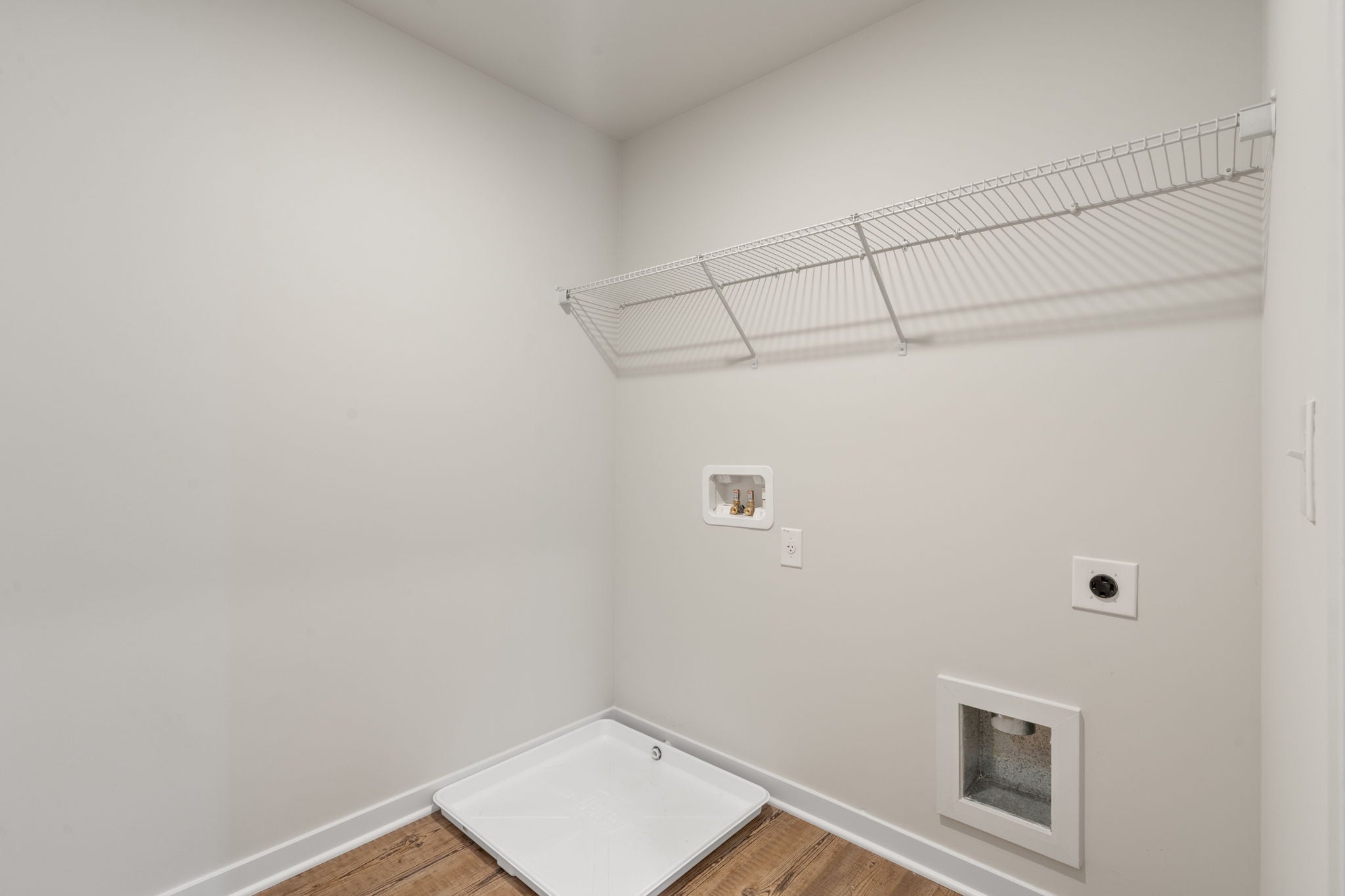 A white room with a shower and a bathtub.