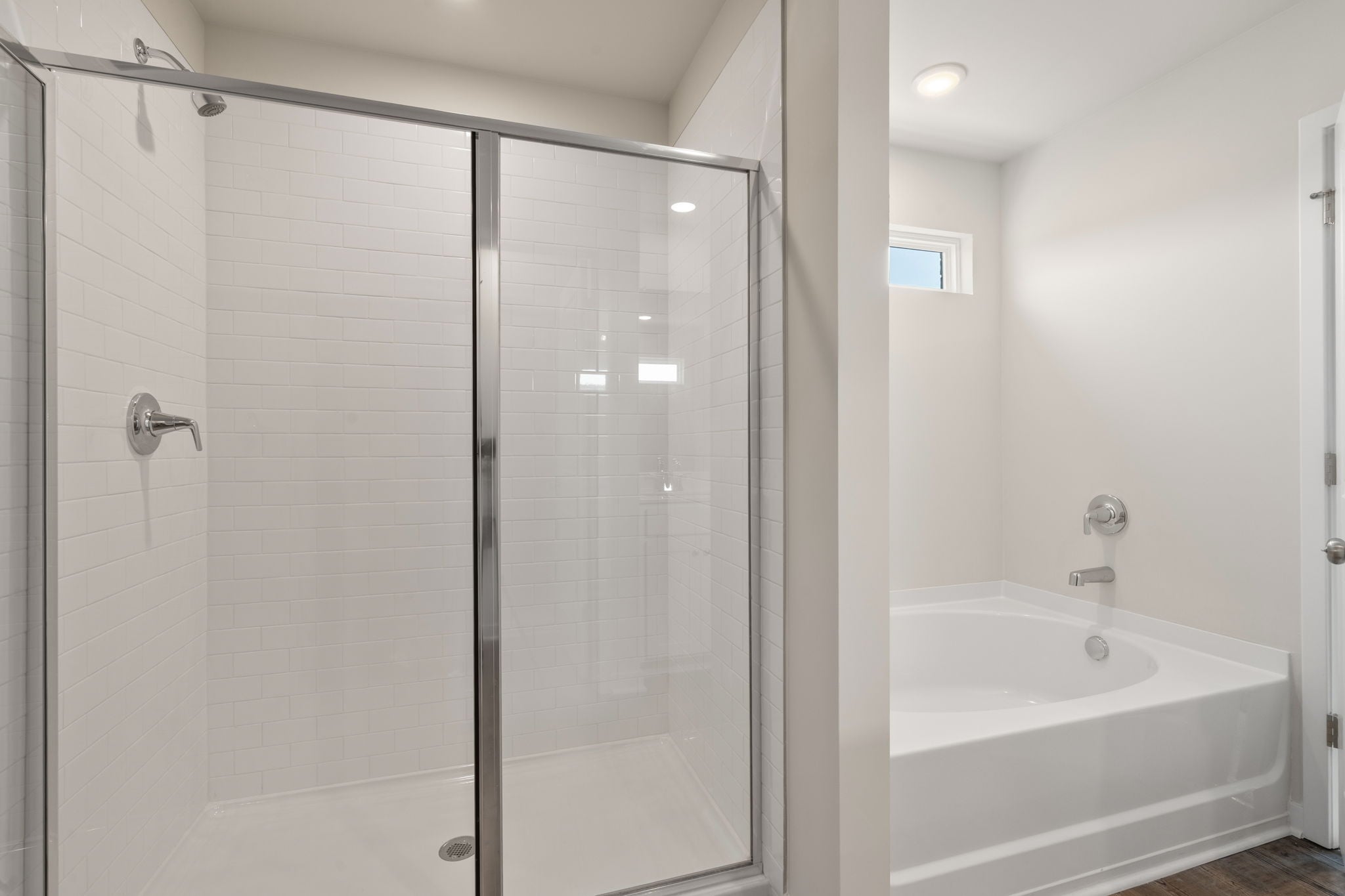 A bathroom with a glass shower.