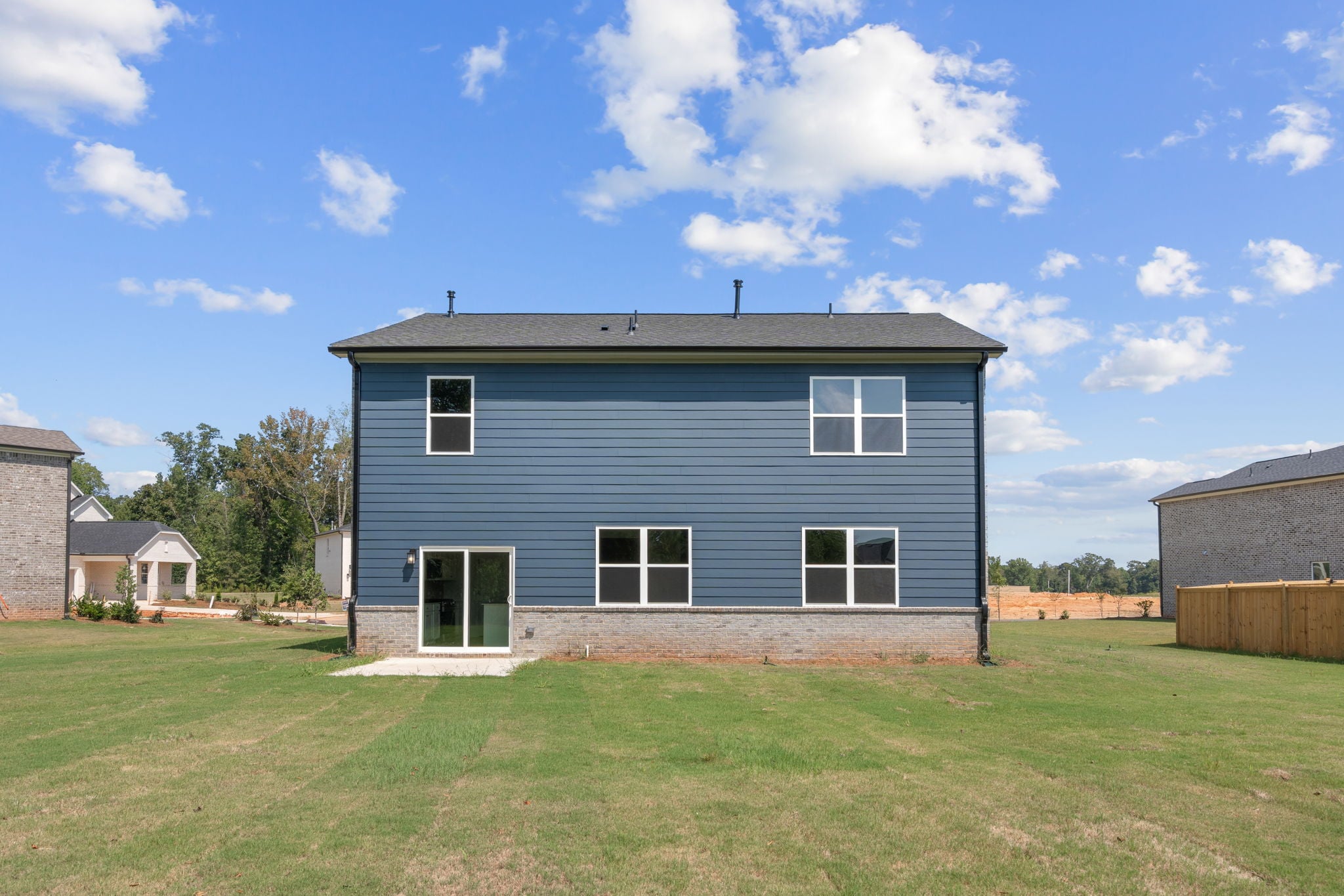 A house with a grass yard.