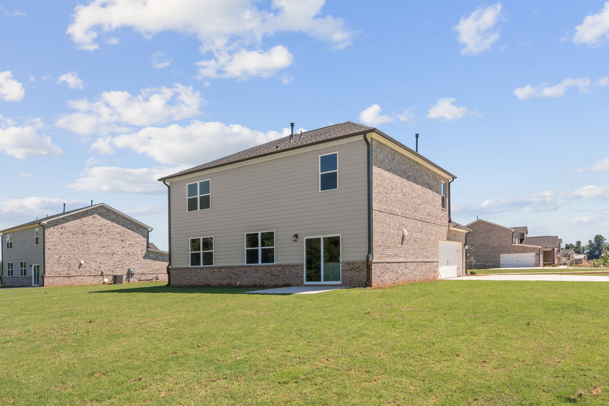 A building with a grass field.