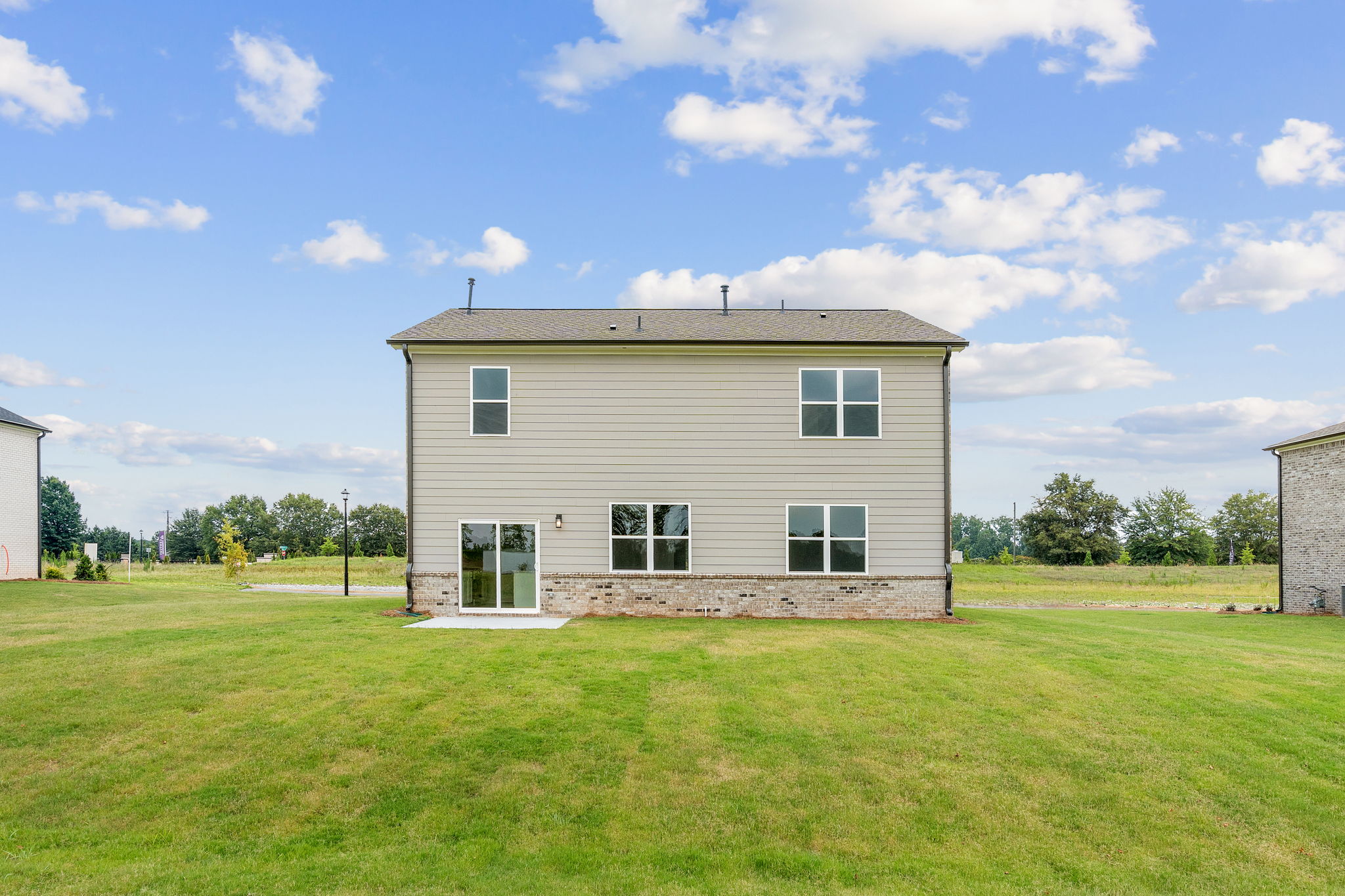 A house in a grassy field.