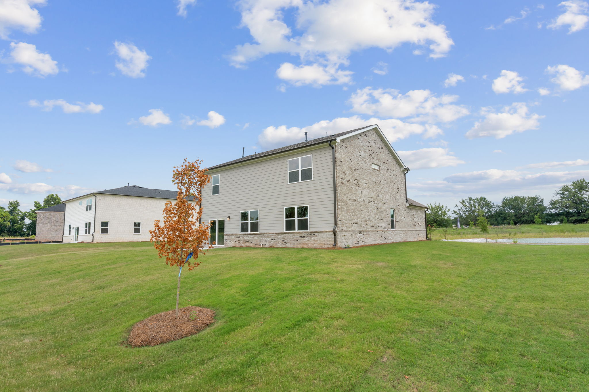 A large building with a tree in front of it.