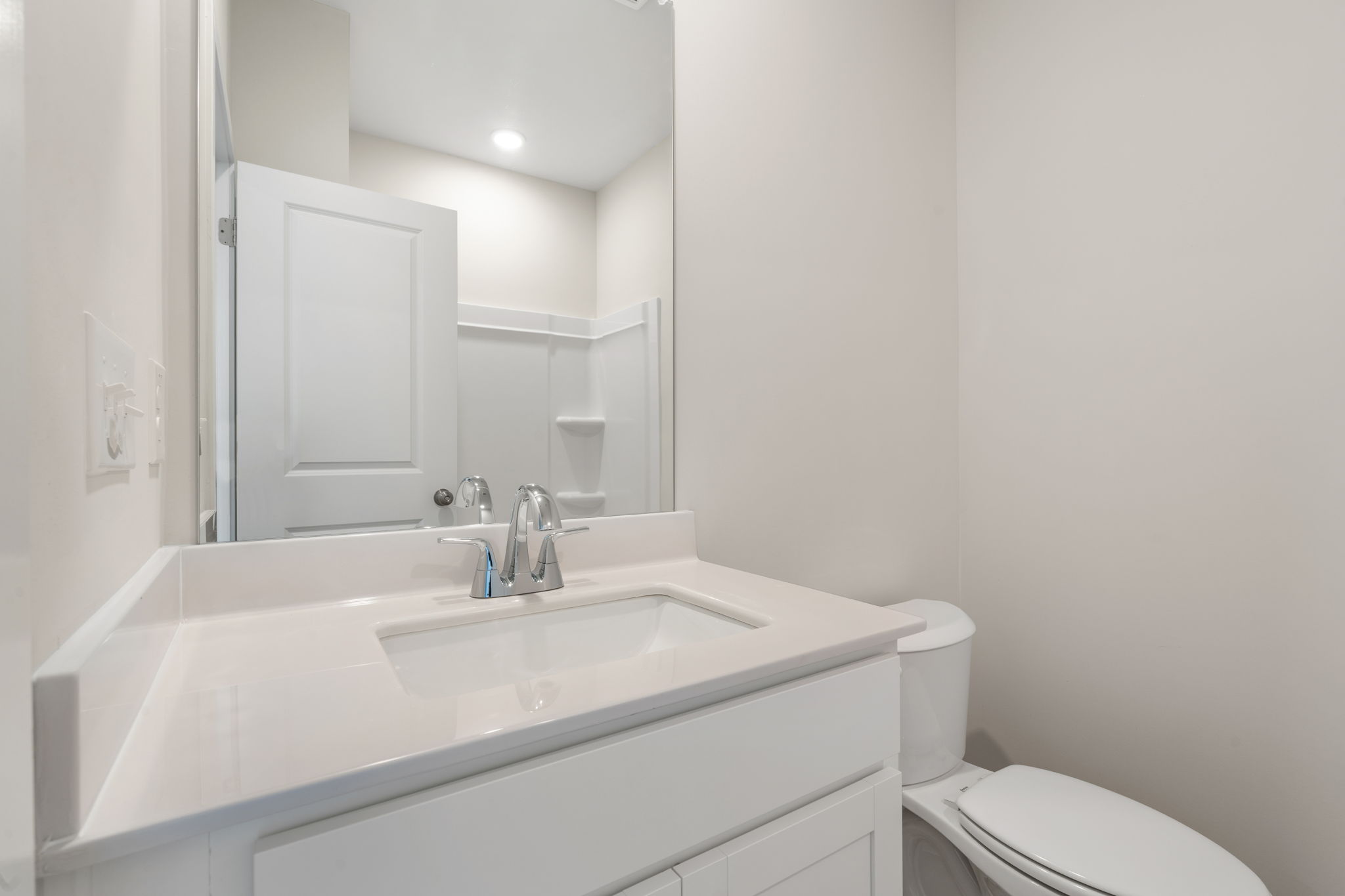 A bathroom with a sink and toilet.