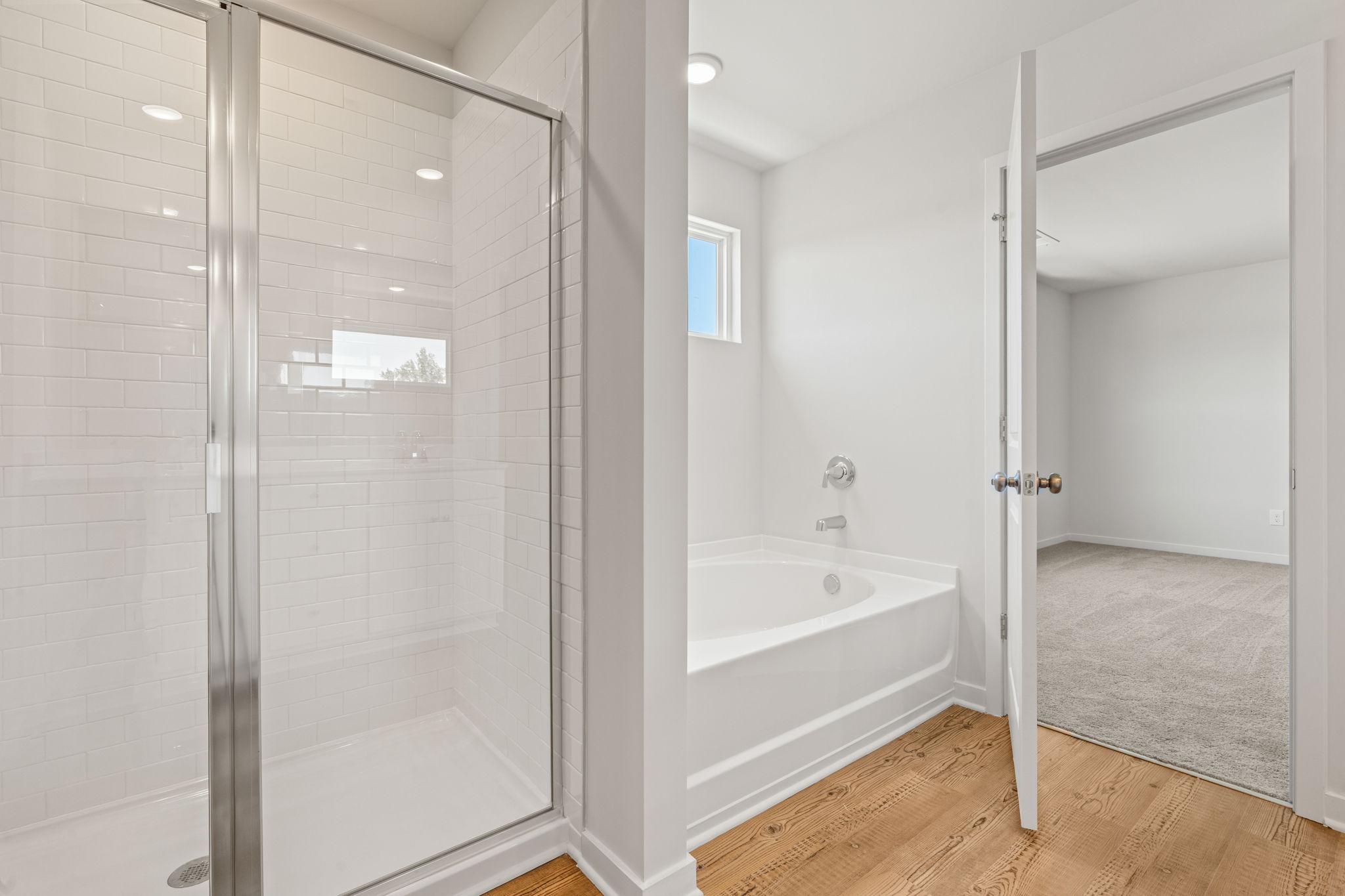 A bathroom with a glass shower.