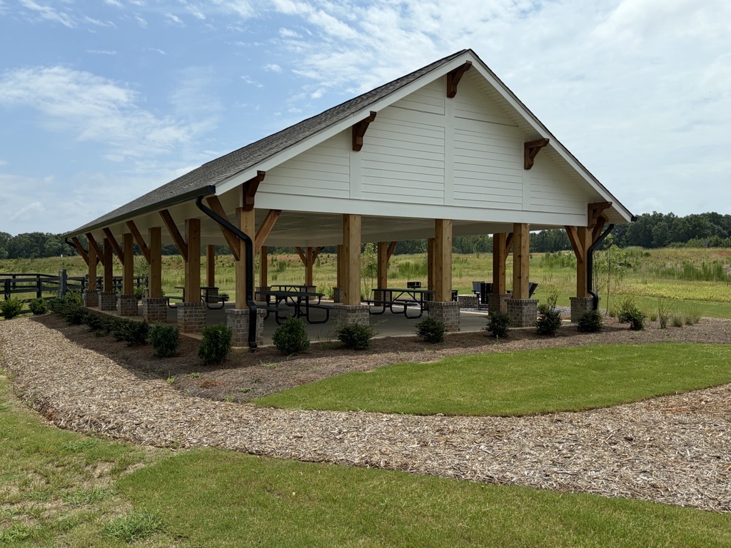 A building with a grass yard.