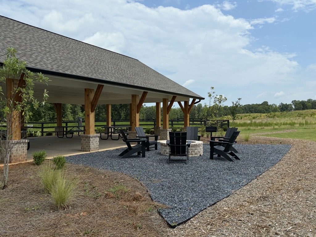 A patio with chairs and tables.