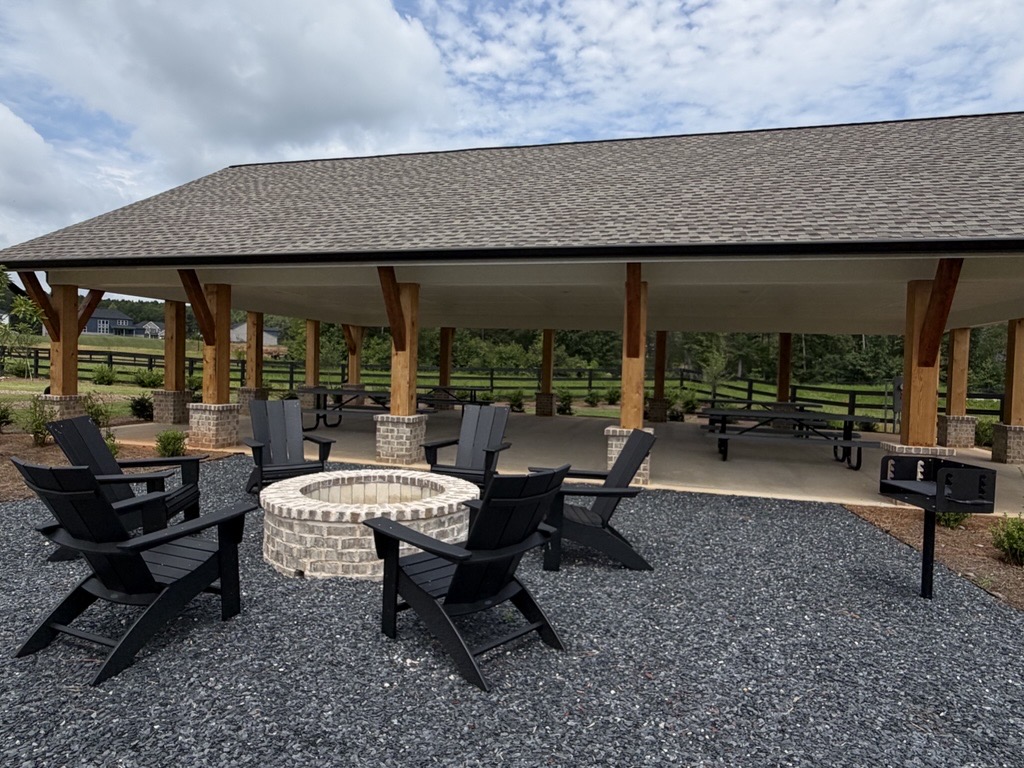 A patio with chairs and tables.