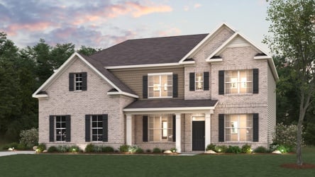 A large house with a lawn in front of it.