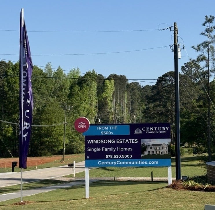 A sign on the side of a road.