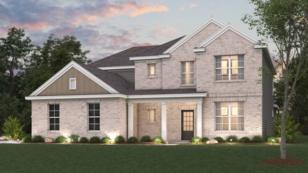 A large house with a lawn in front of it.