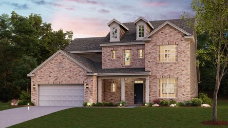 A brick house with a garage.