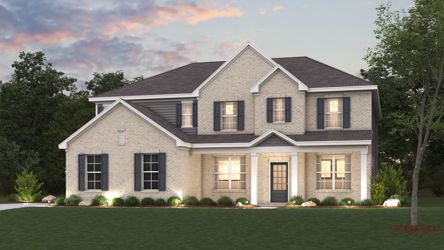 A large house with a lawn in front of it.