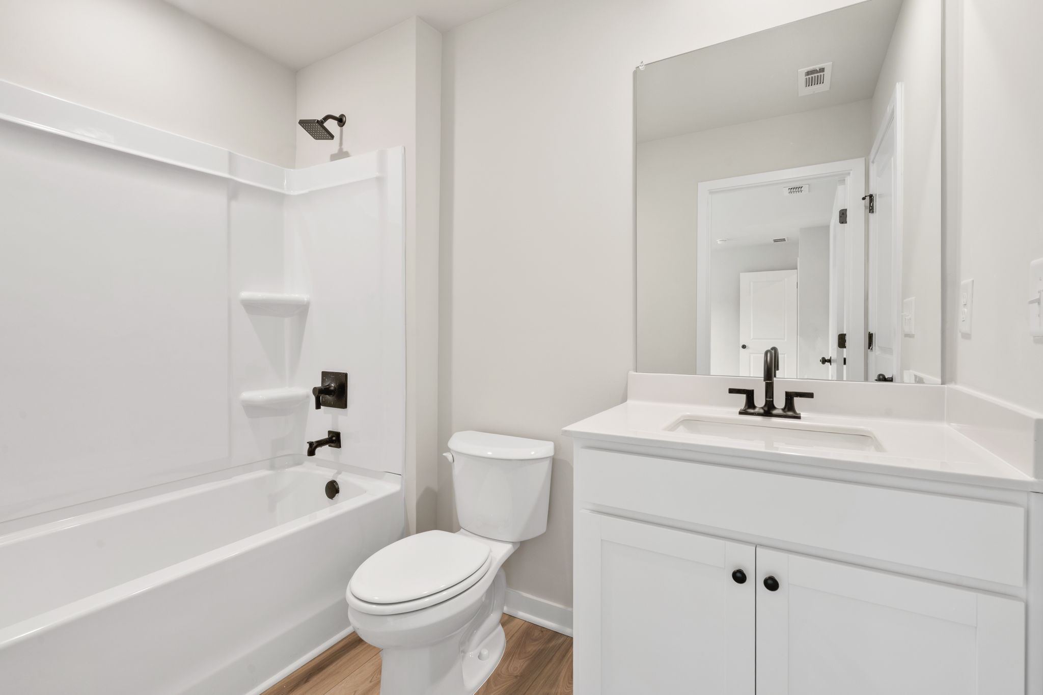 A bathroom with a toilet and sink.