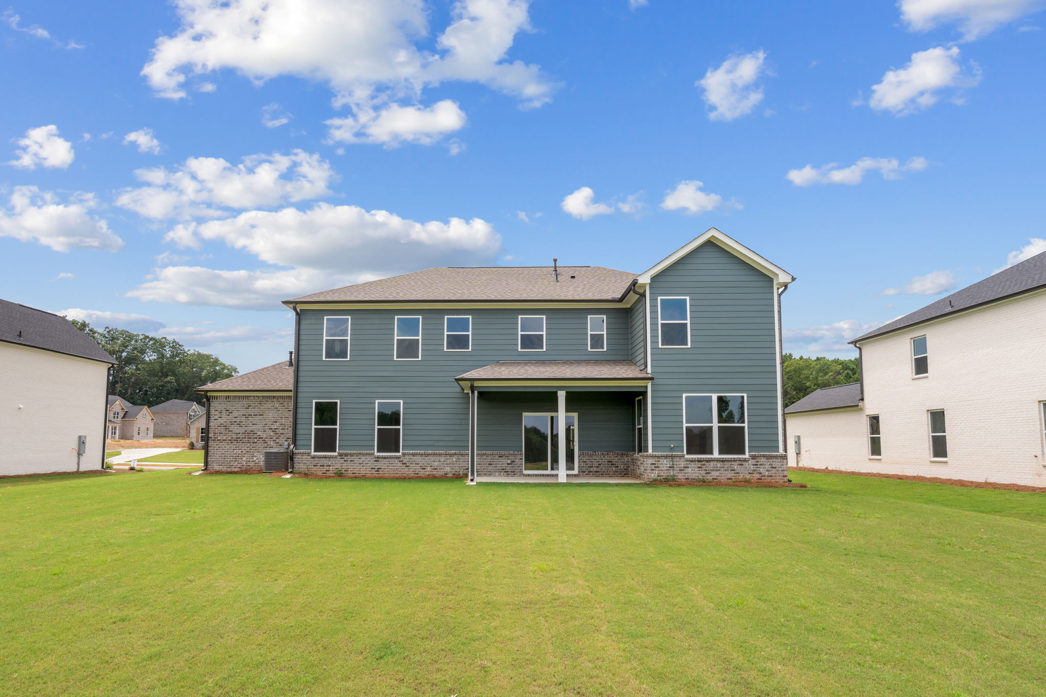 A house with a grass yard.