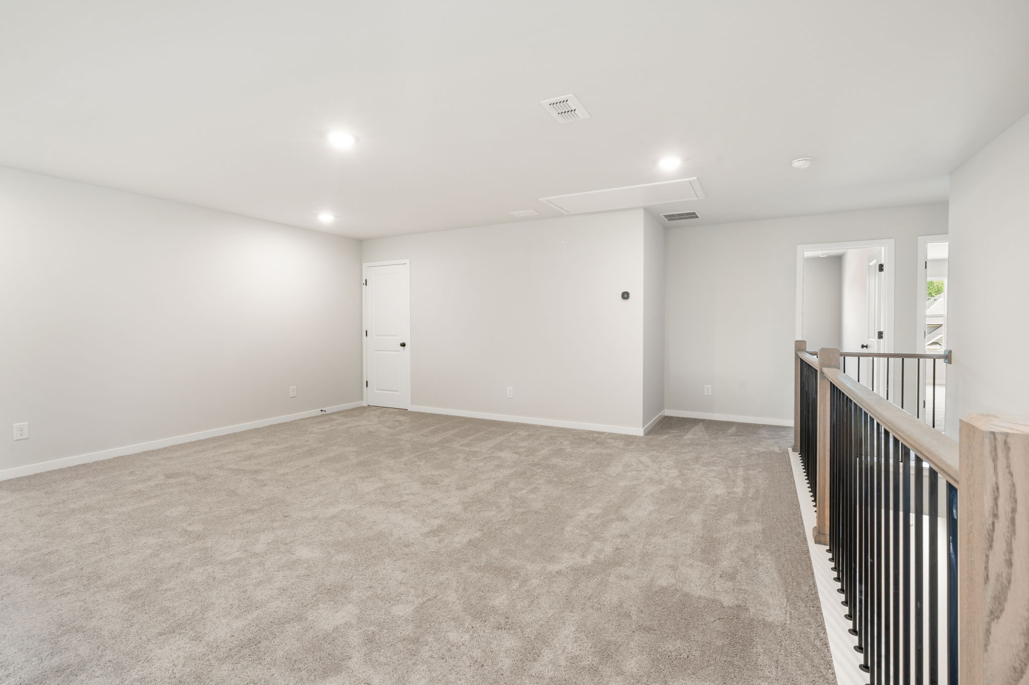 A hallway with white walls.