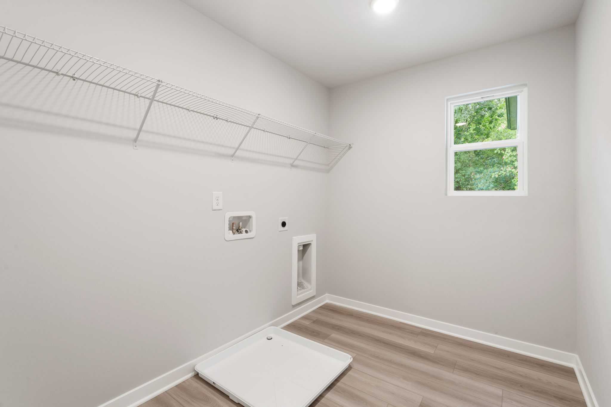 A room with a table and a window.