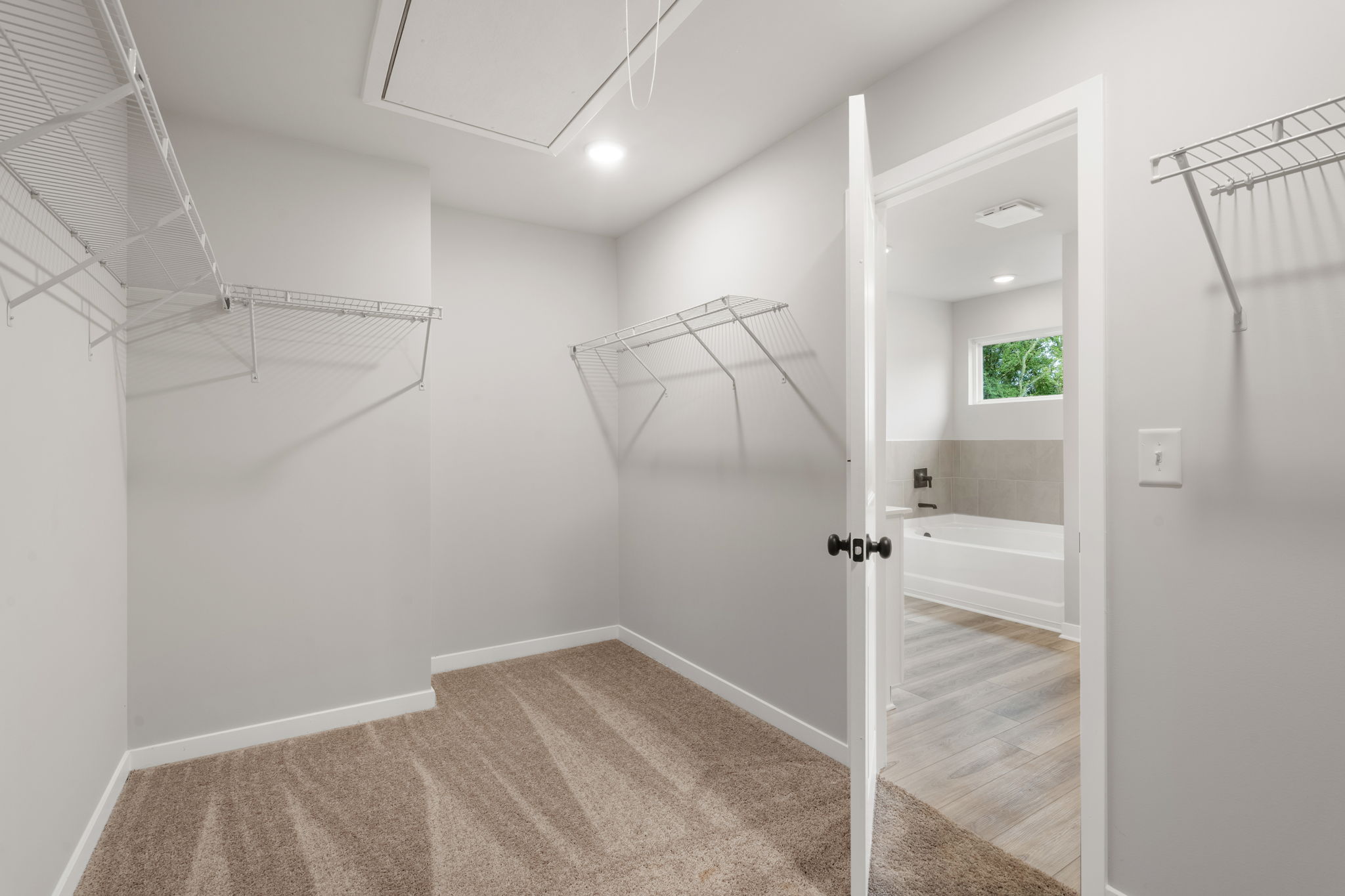 A bathroom with a shower and a bathtub.