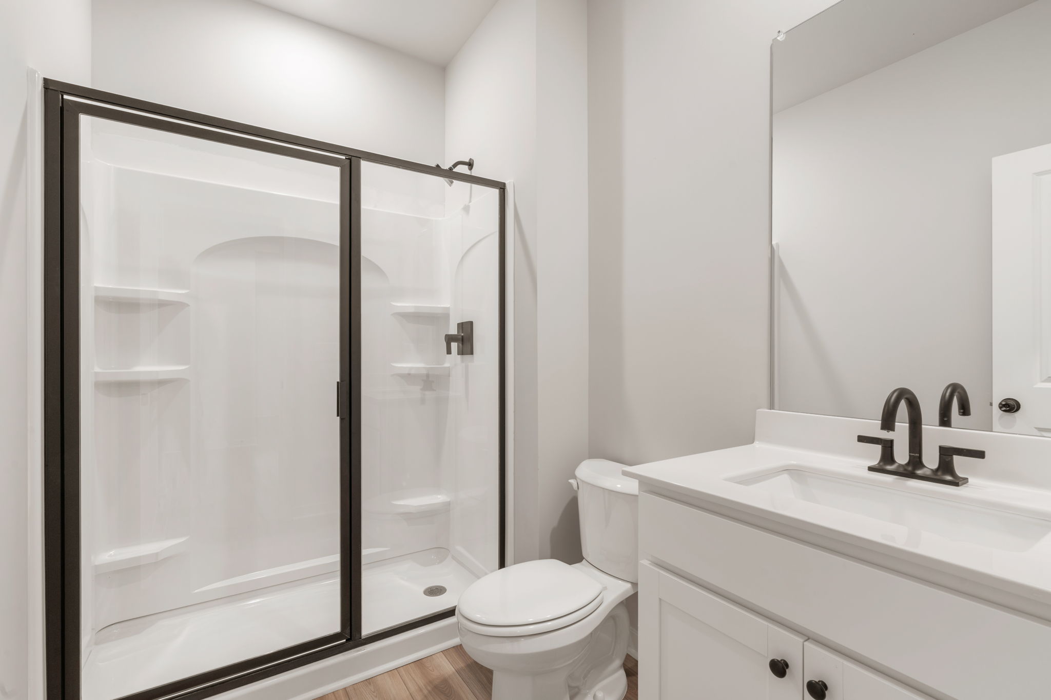 A bathroom with a glass shower.