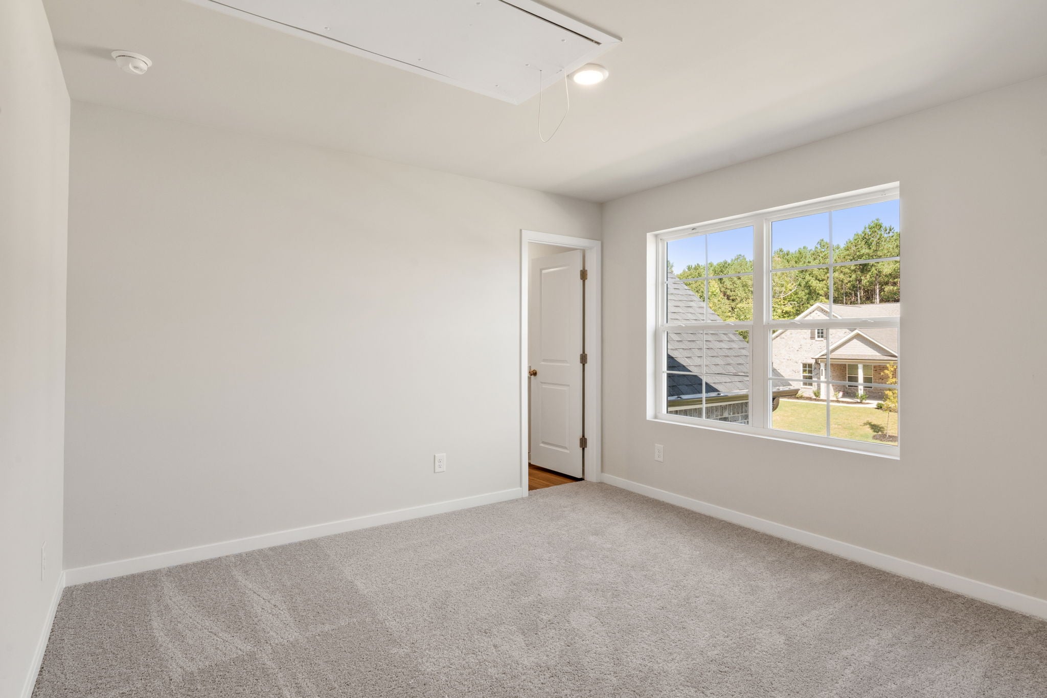 A room with a door and a window.