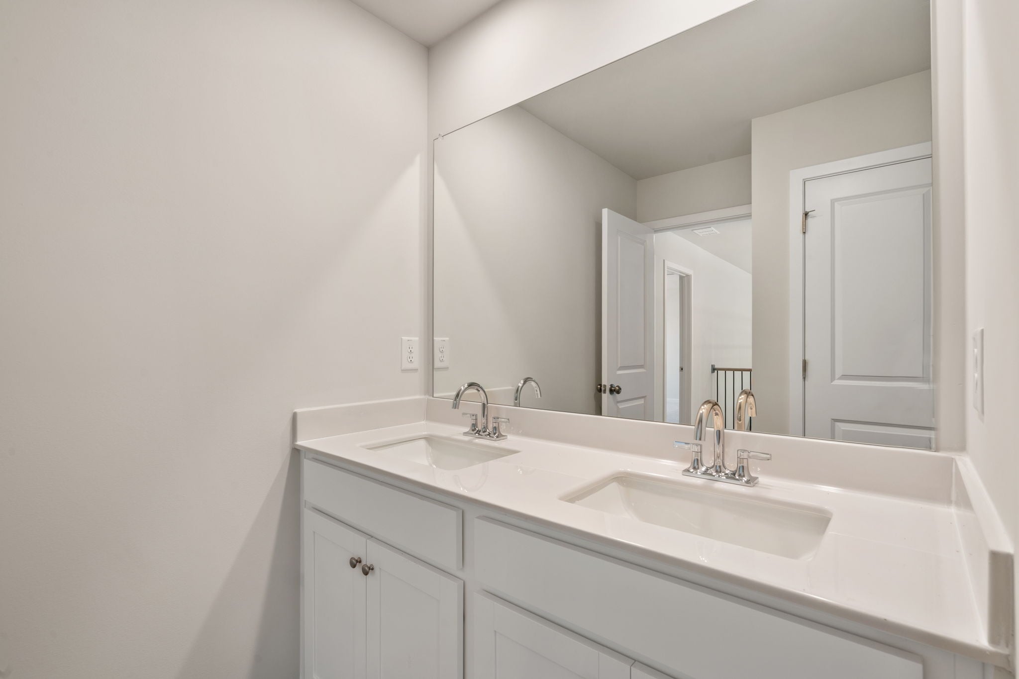A bathroom with two sinks.