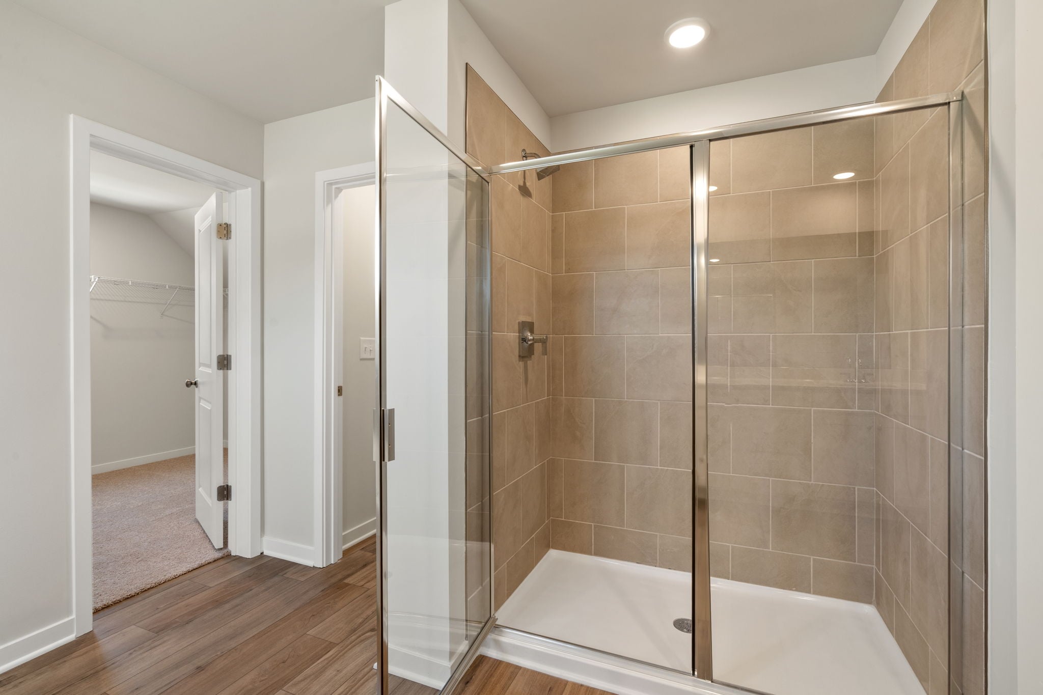 A bathroom with a glass shower.