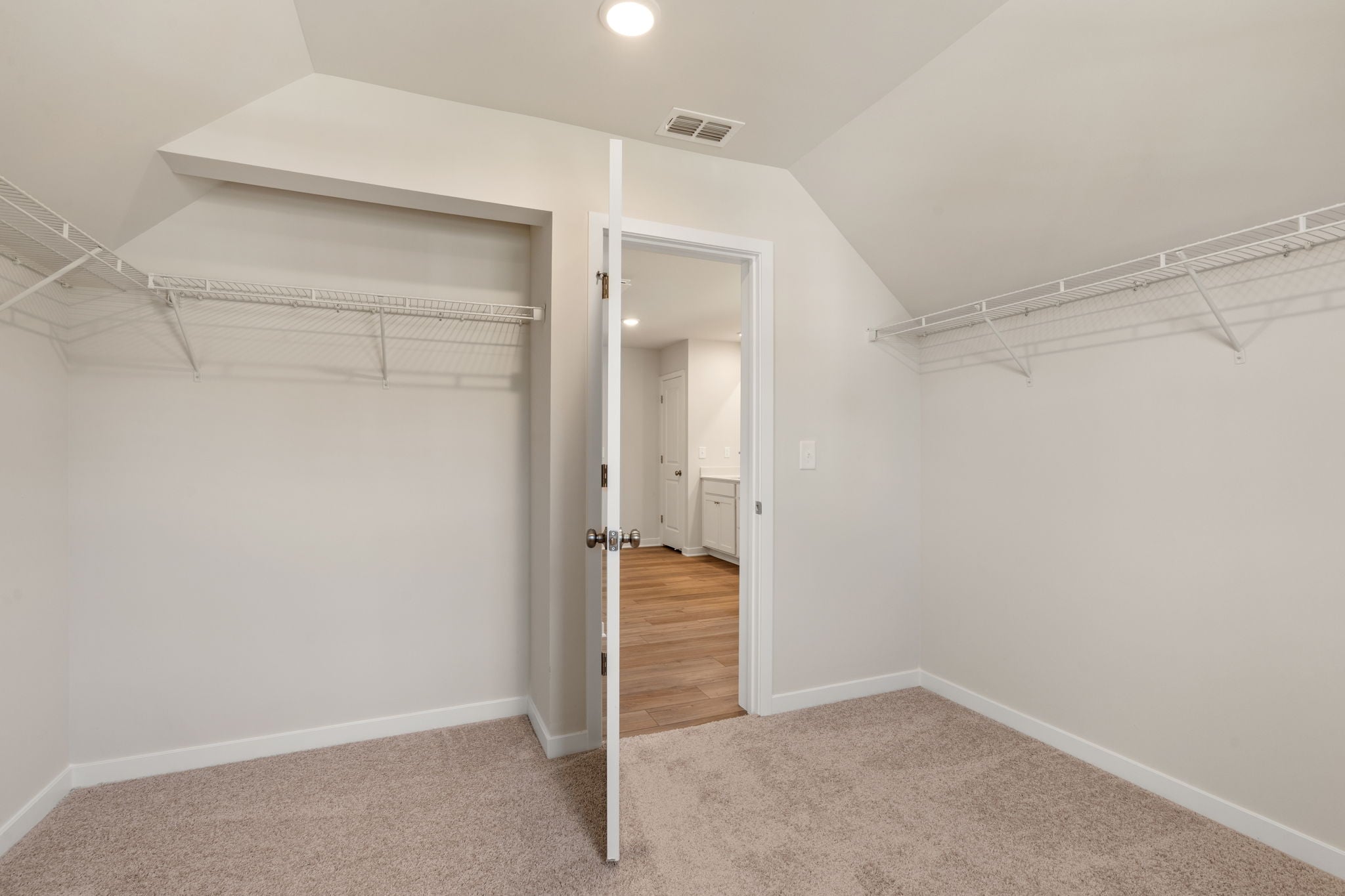 A hallway with white walls.
