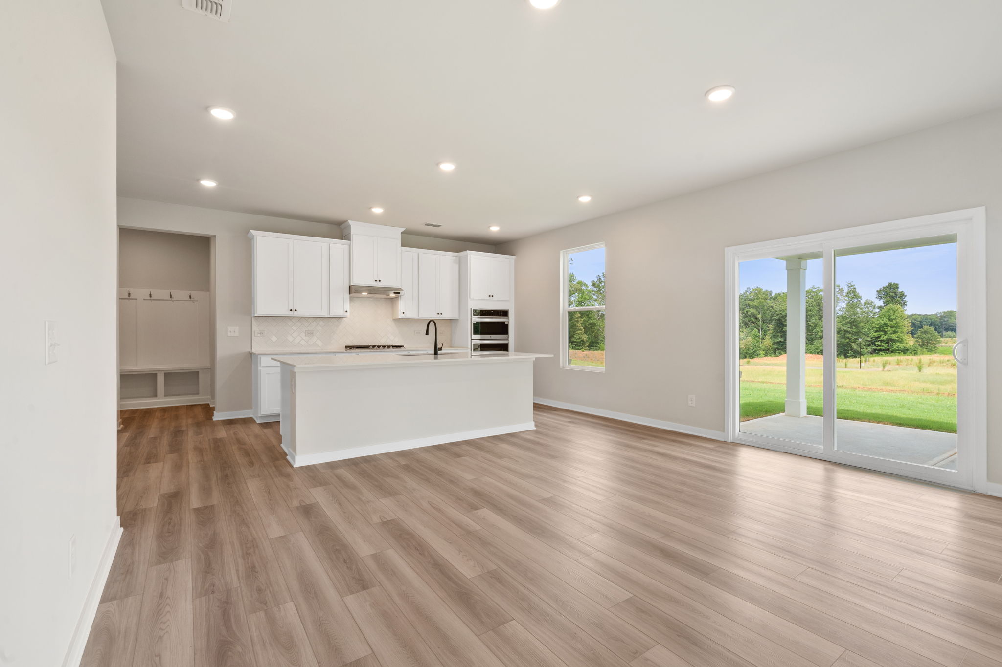 A large kitchen with white cabinets.