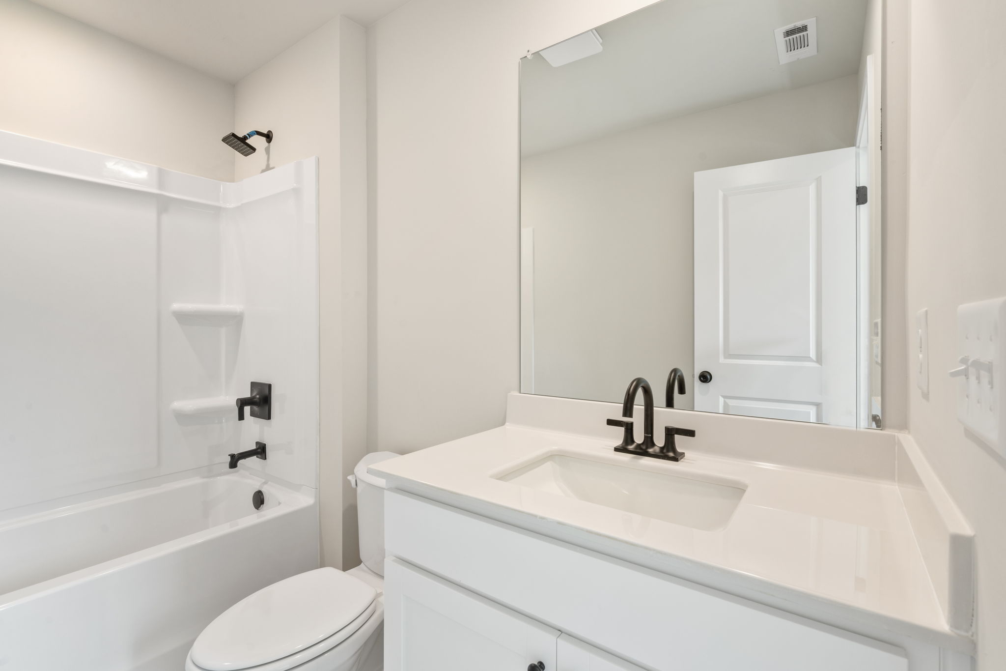 A bathroom with a sink and a toilet.