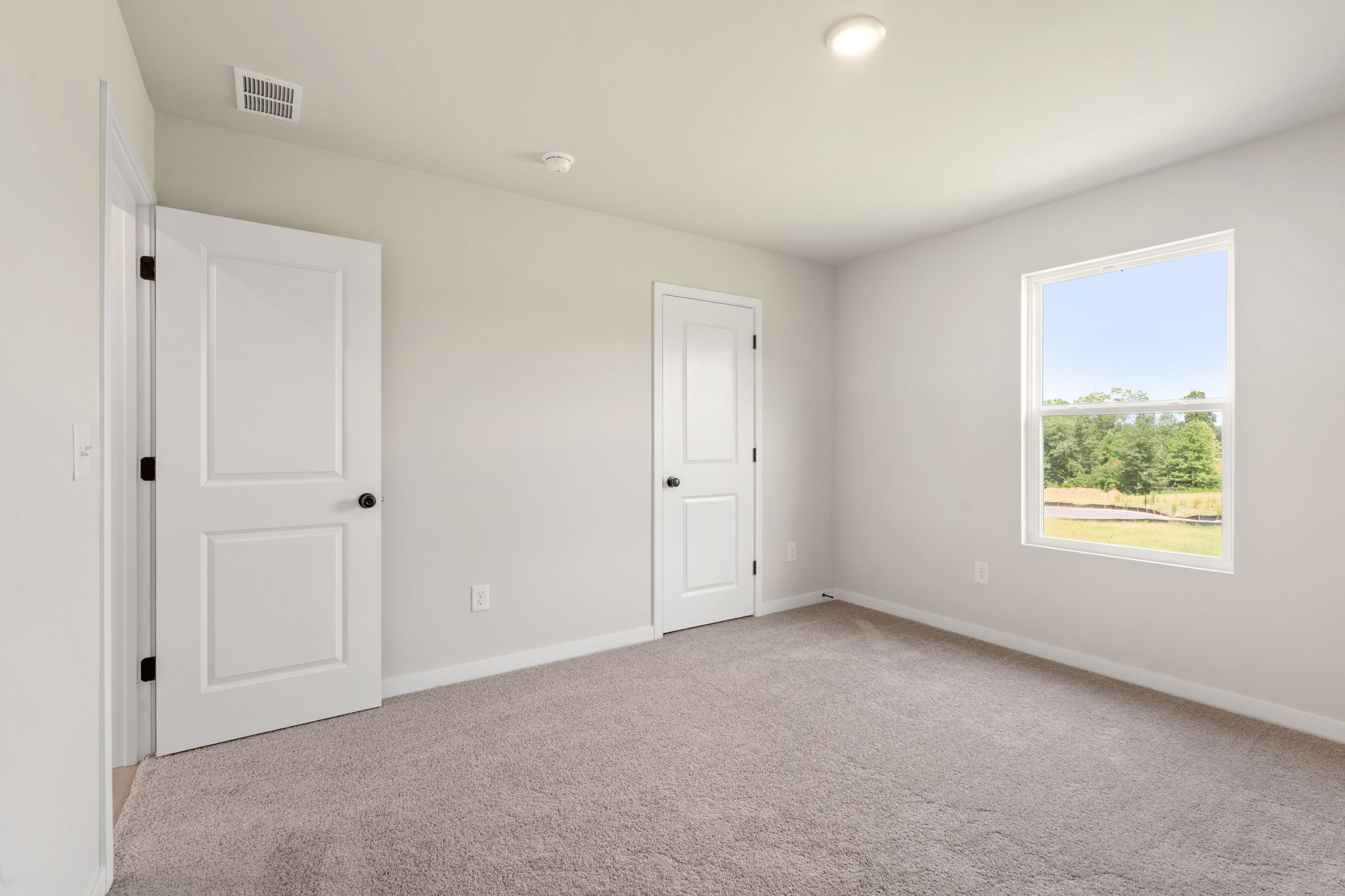 A room with white doors.