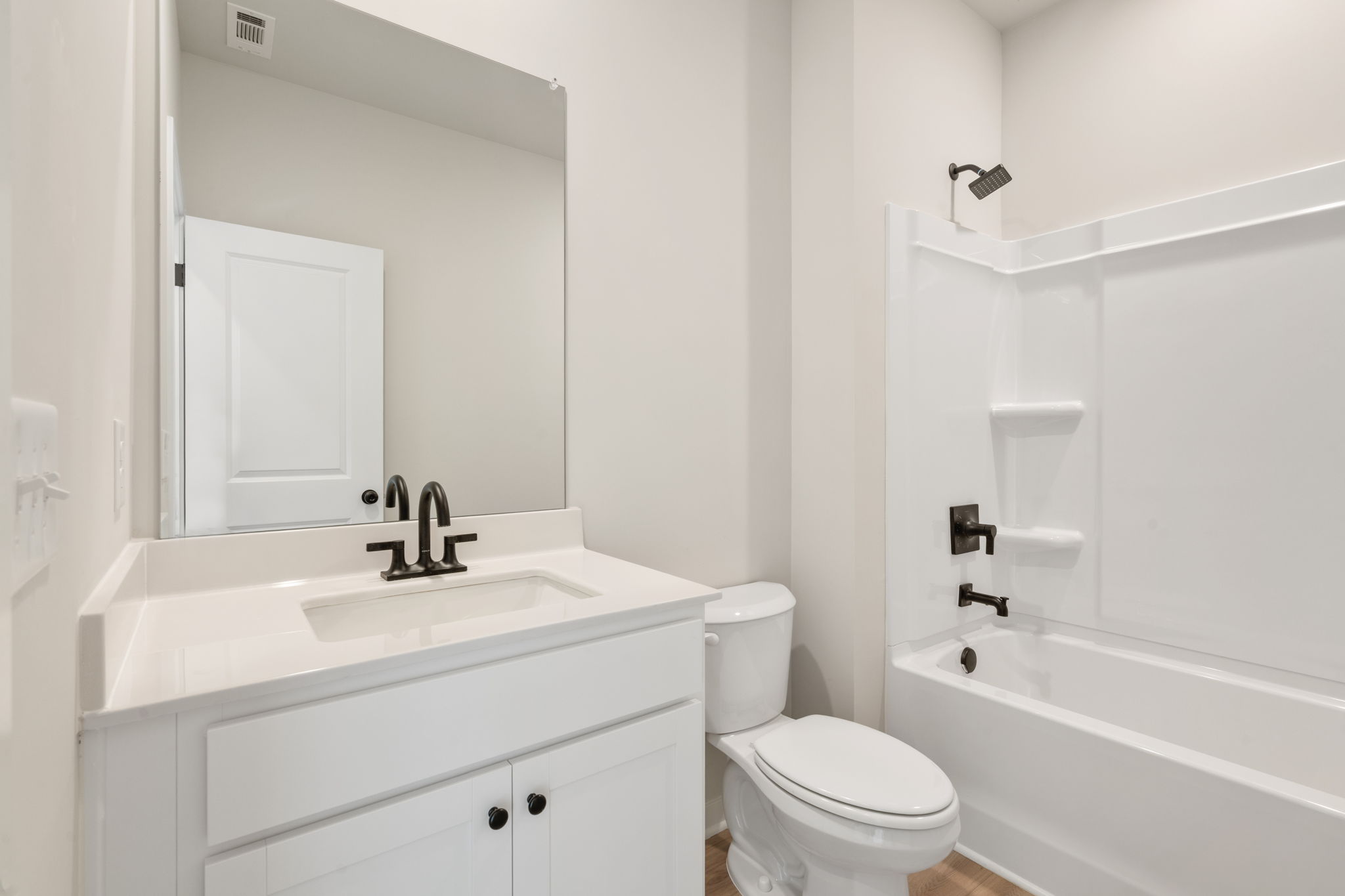 A bathroom with a toilet and sink.