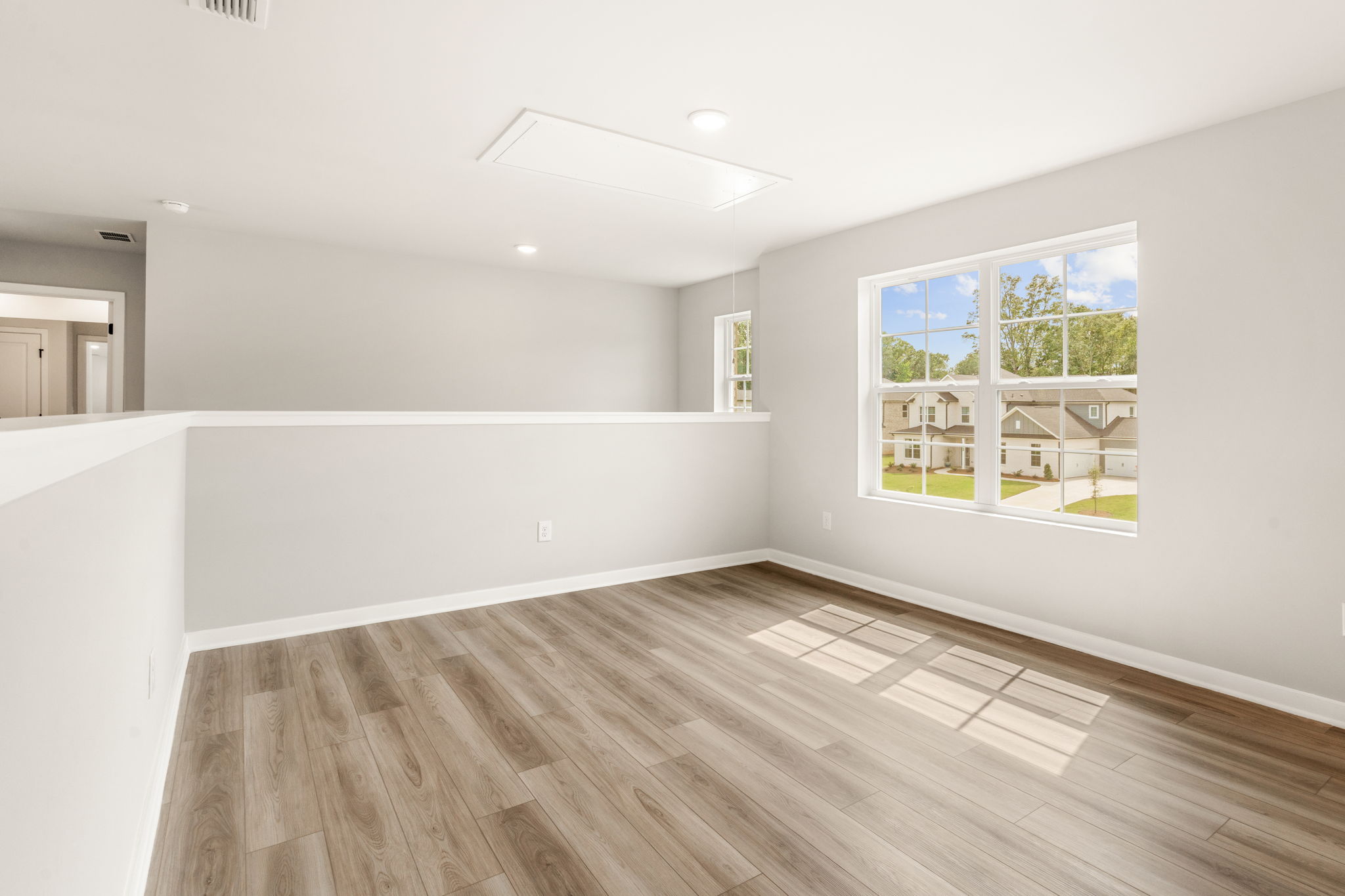 A room with a wood floor and a wood floor.