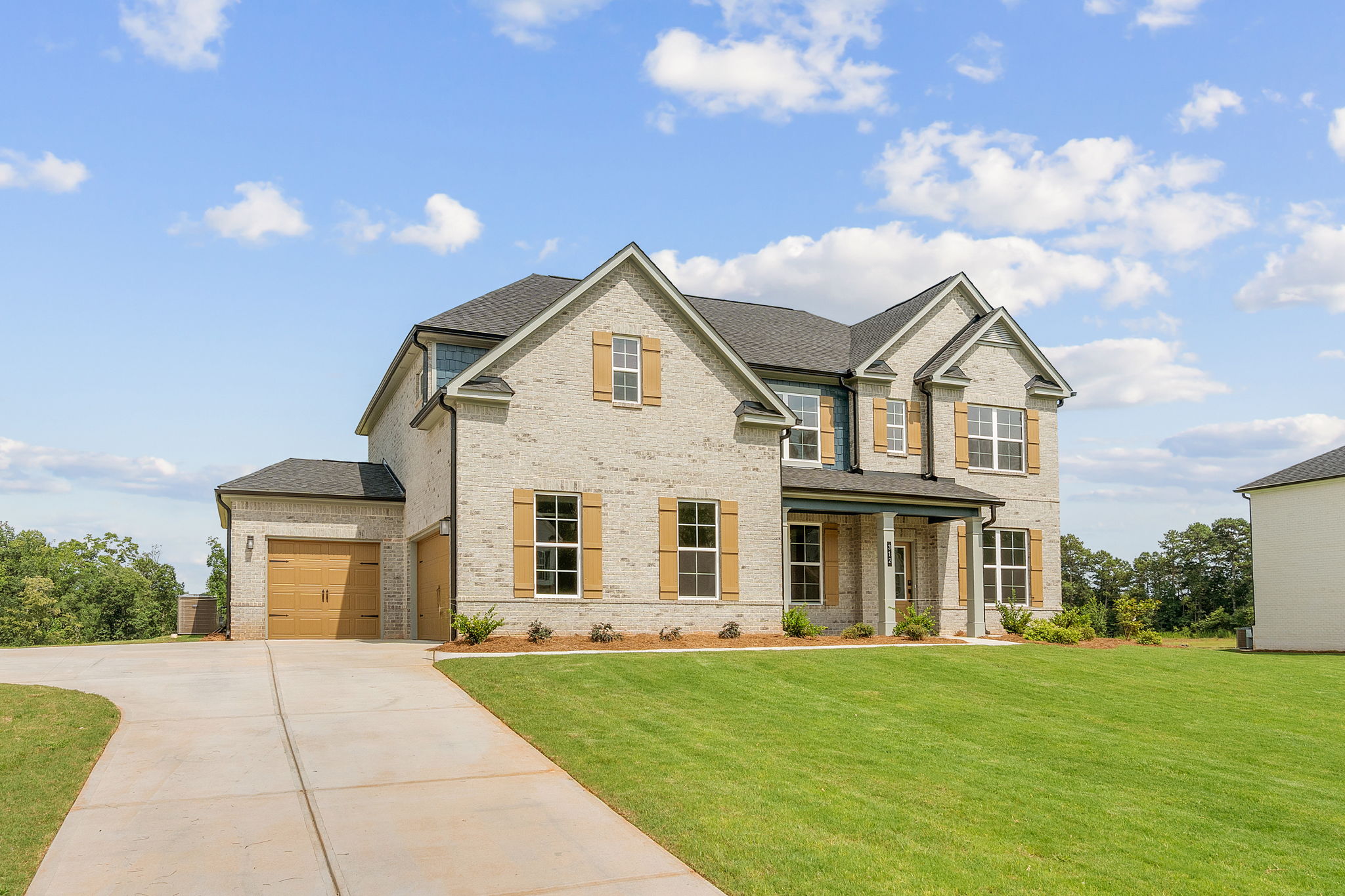 A large house with a driveway.