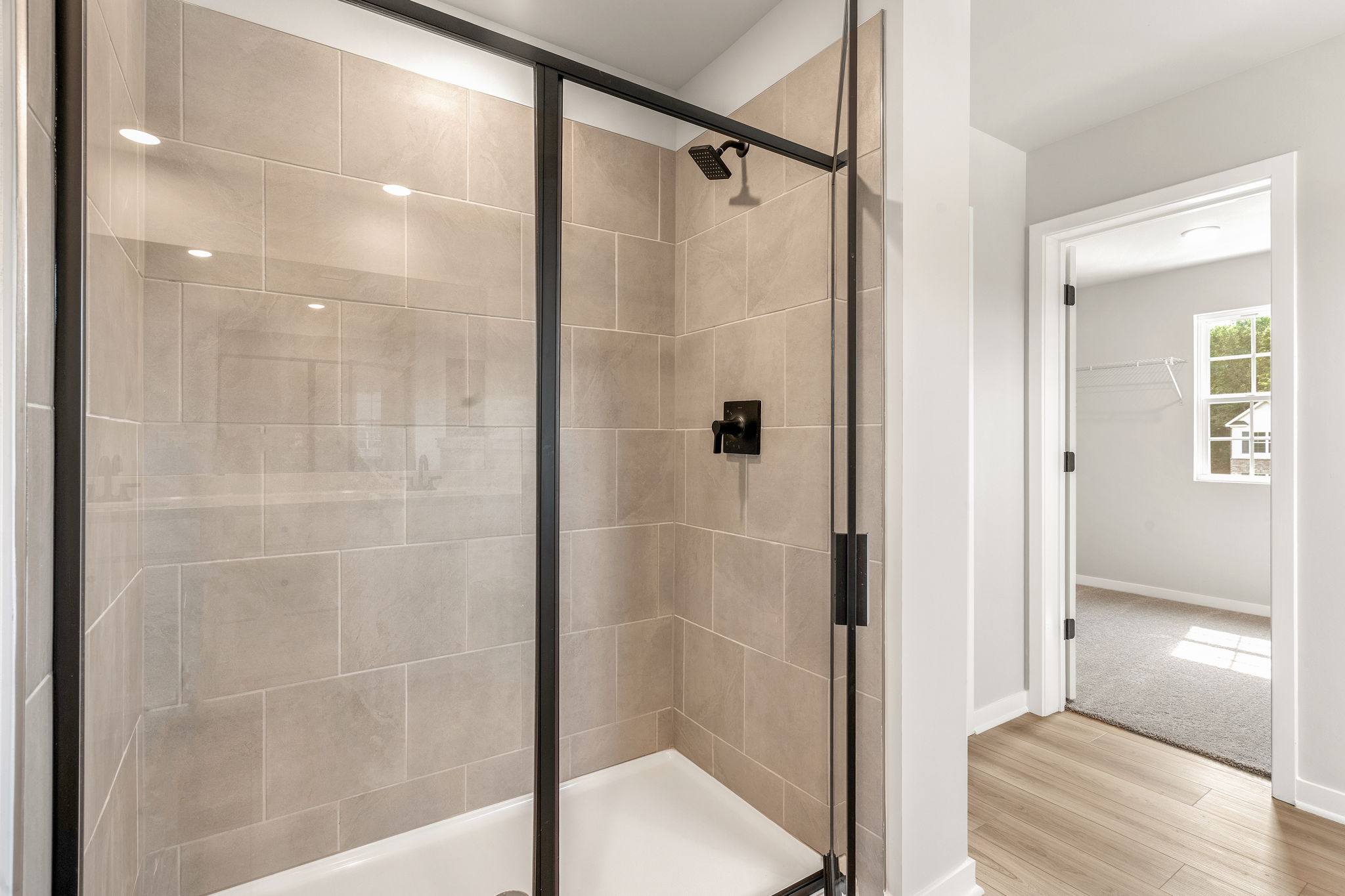 A bathroom with a glass shower.