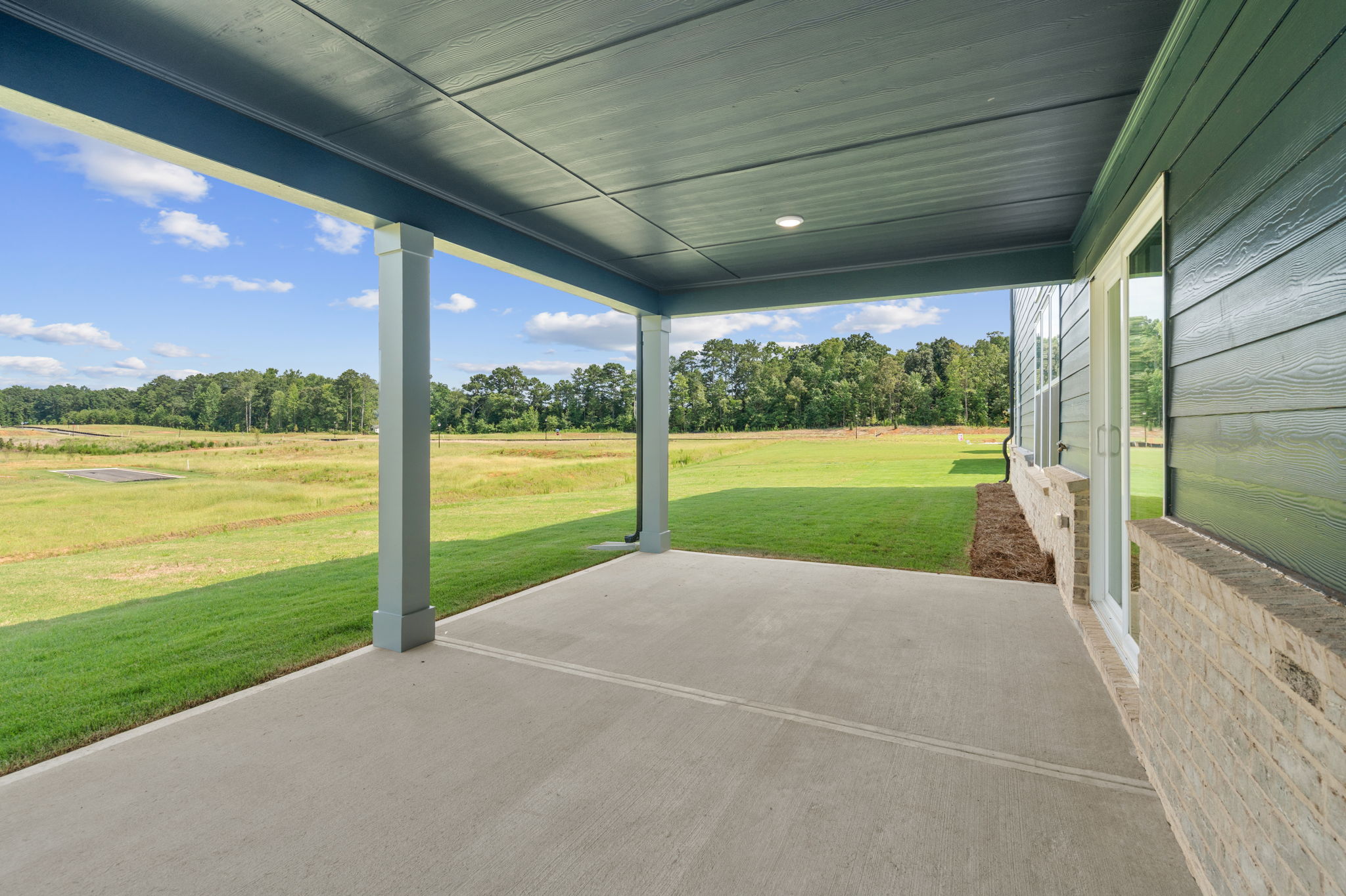 A building with a grass field.
