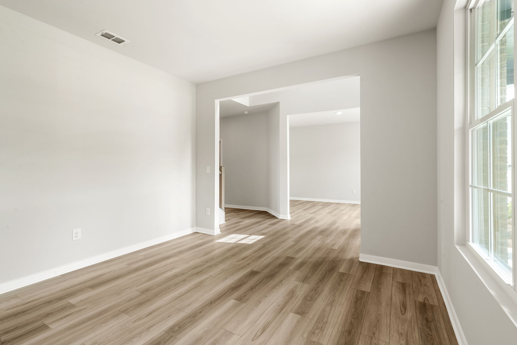A room with a wood floor and a wood floor.