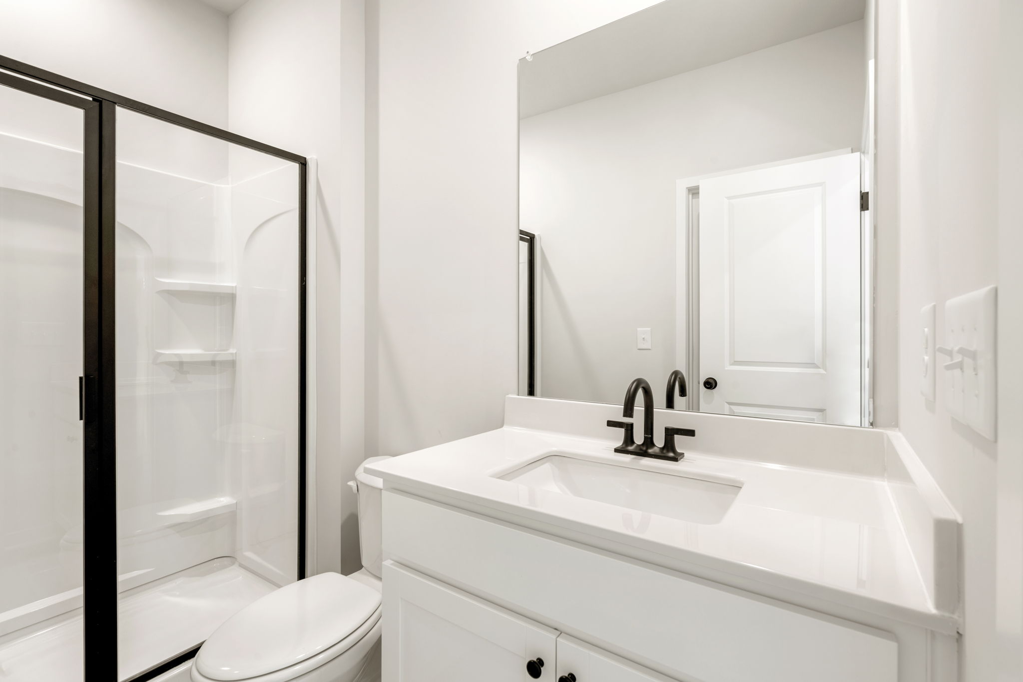 A bathroom with a glass shower.