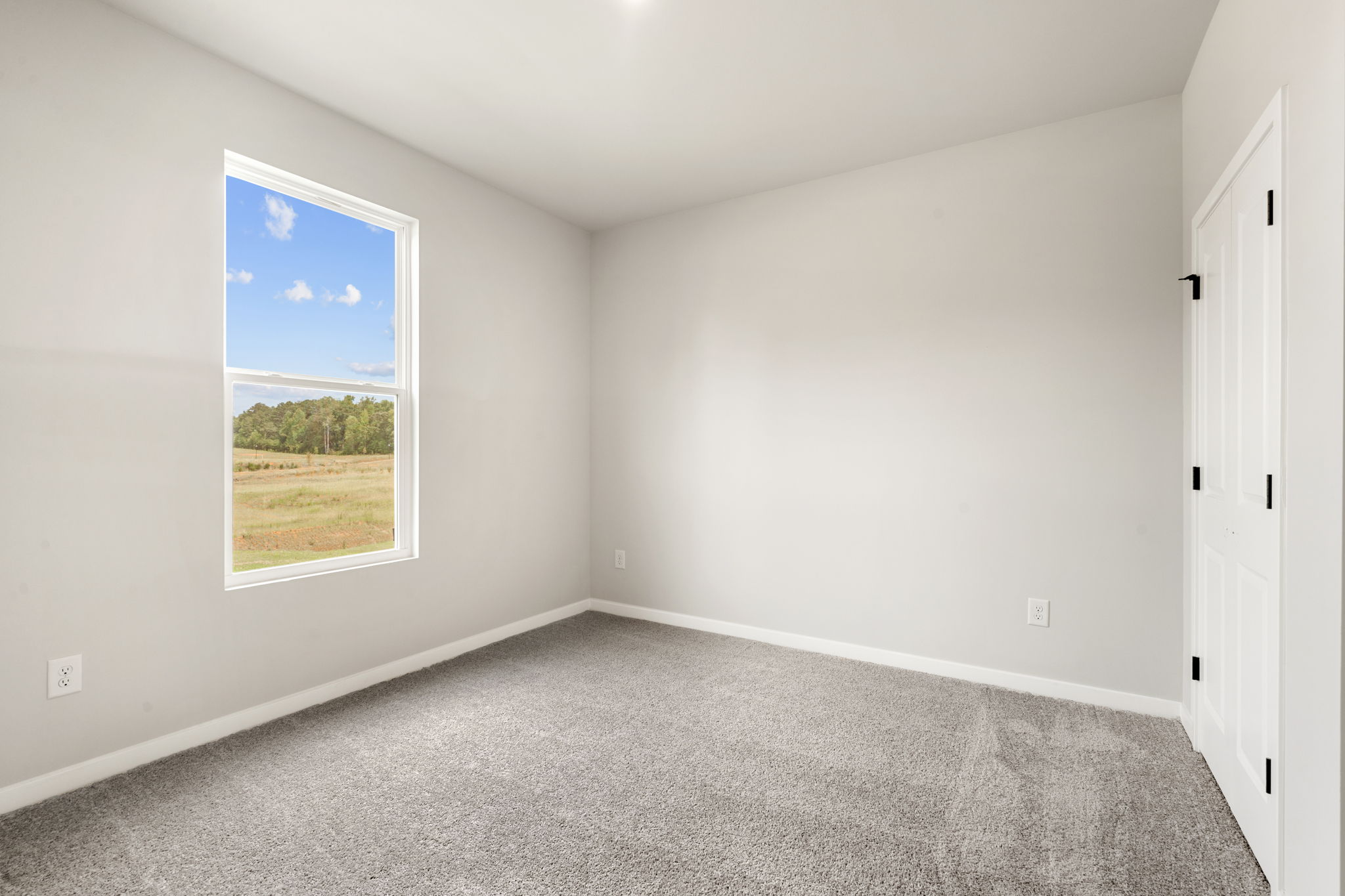 A hallway with a window.