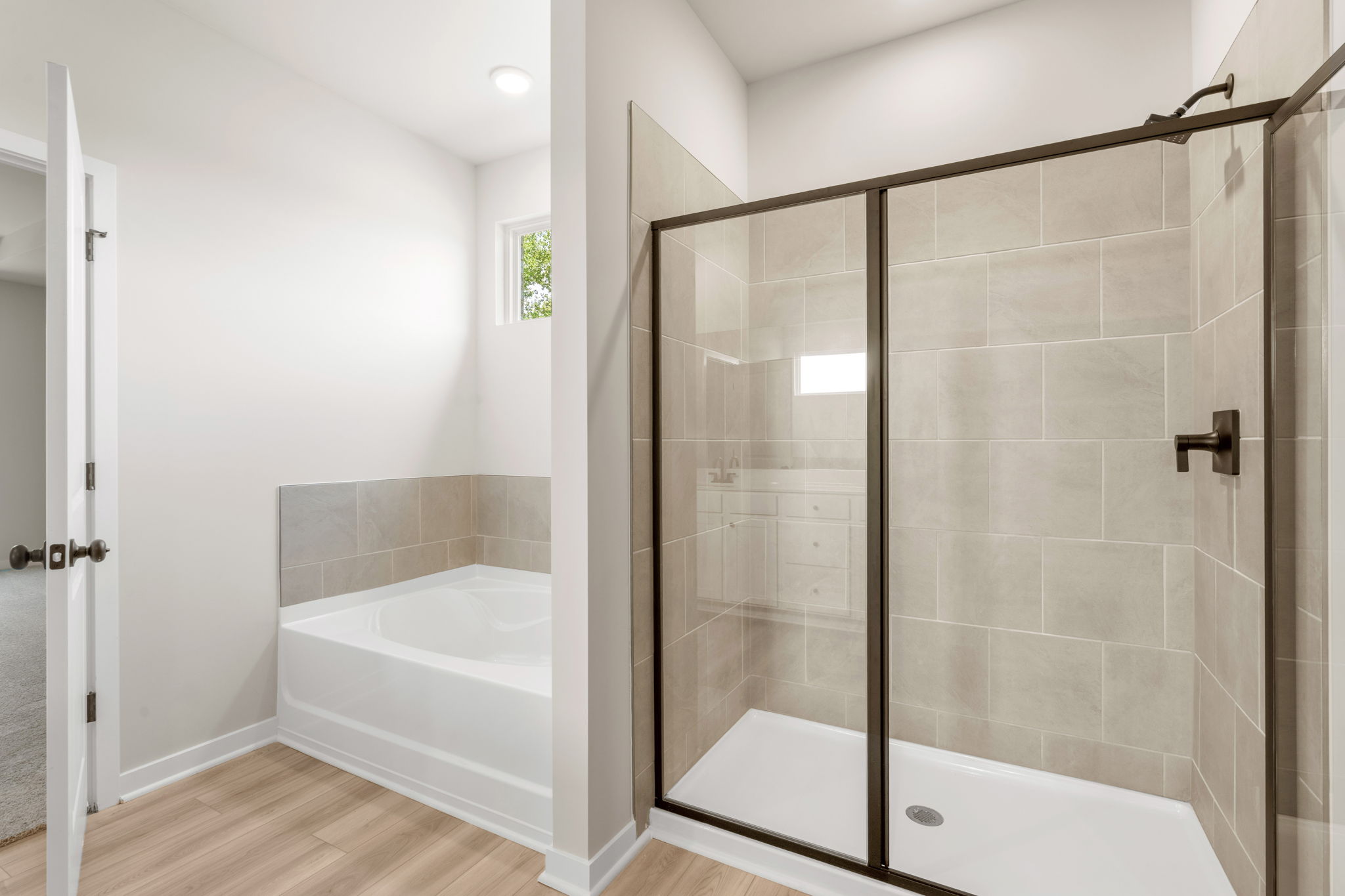 A bathroom with a glass shower.