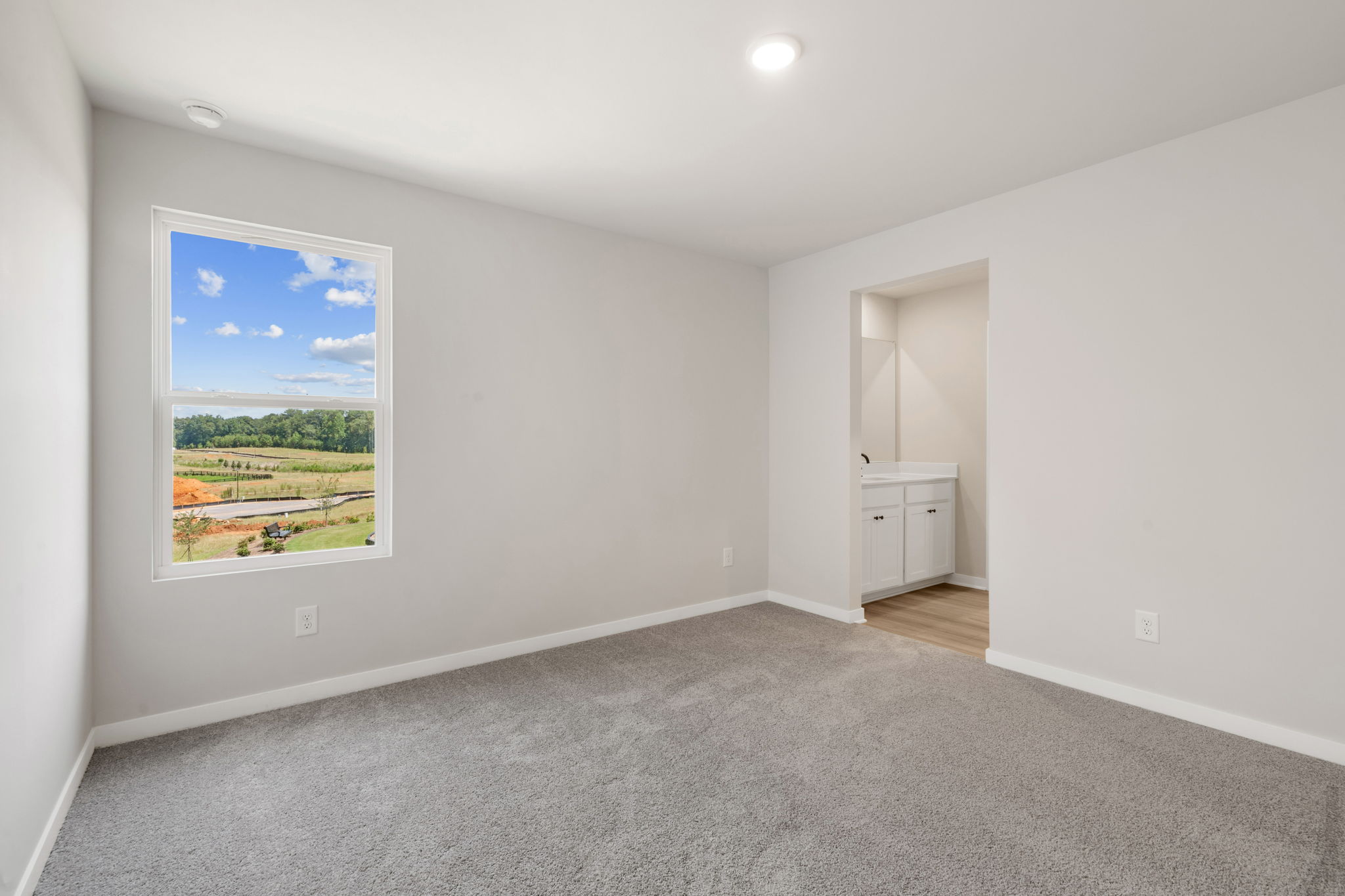 A room with a large painting on the wall.