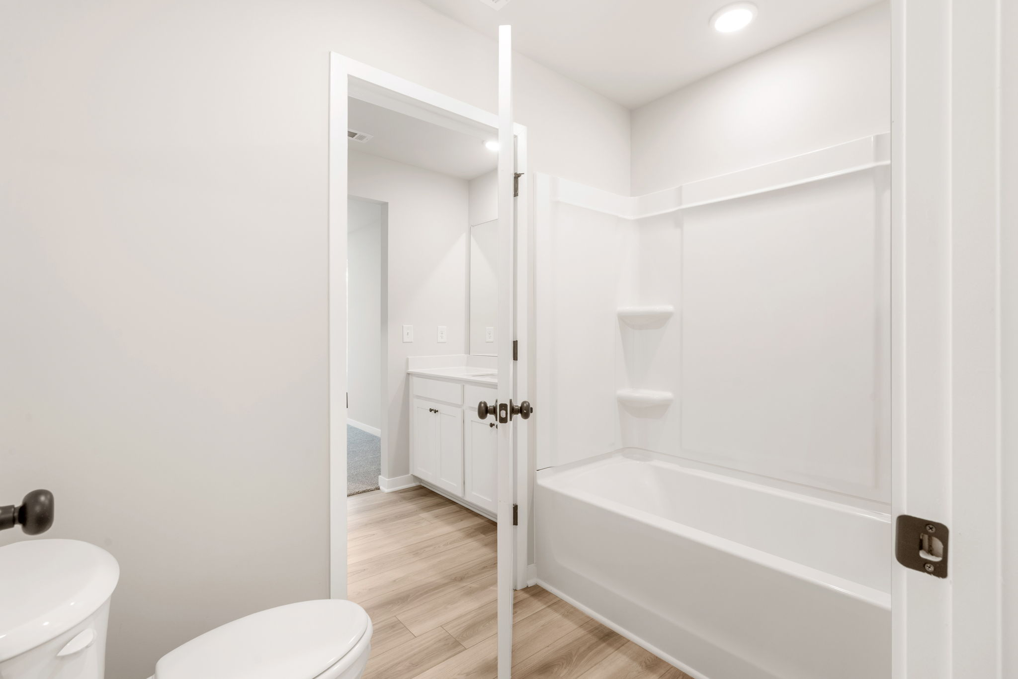 A bathroom with a glass shower.