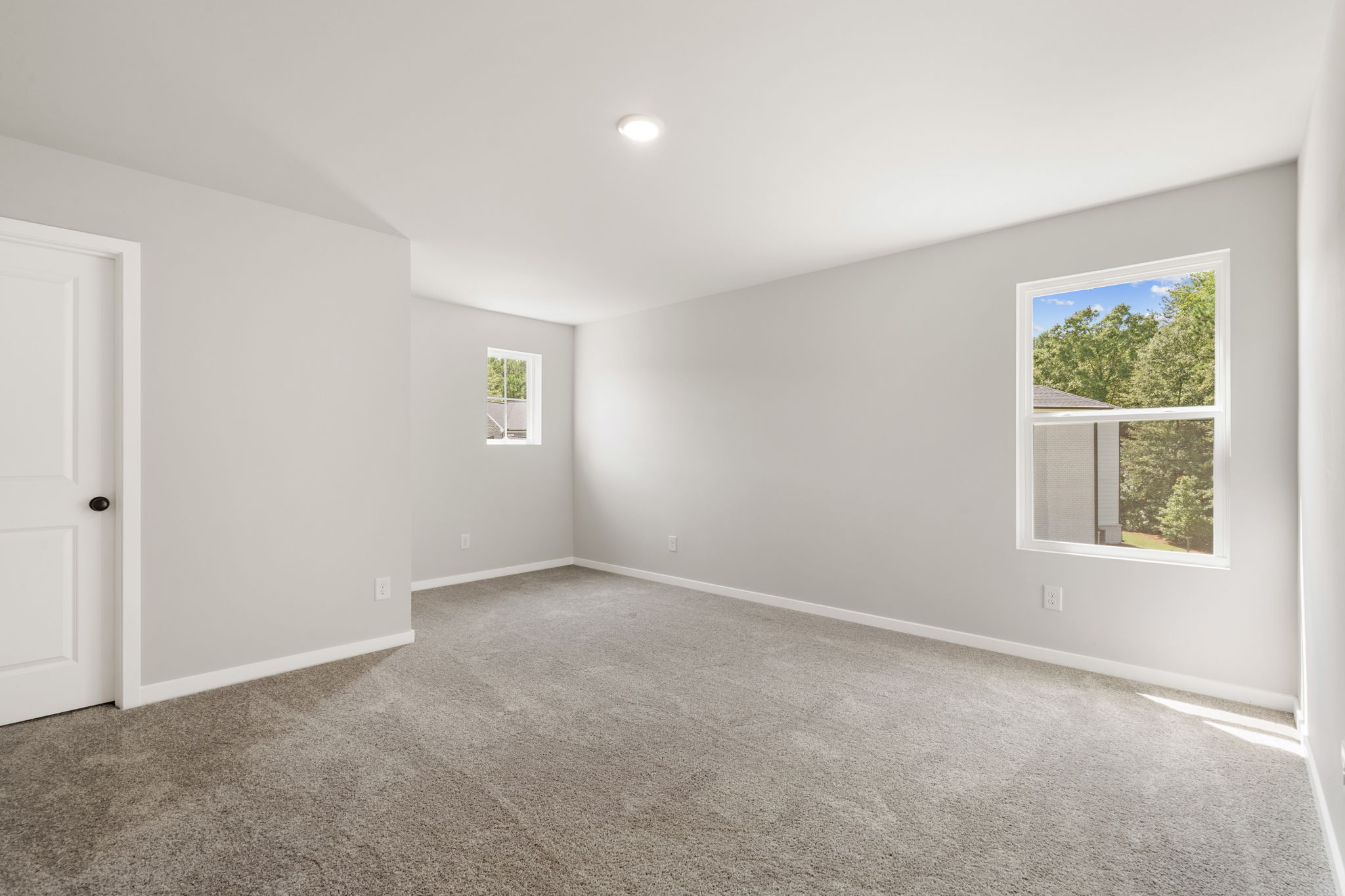 A room with a window and a door.