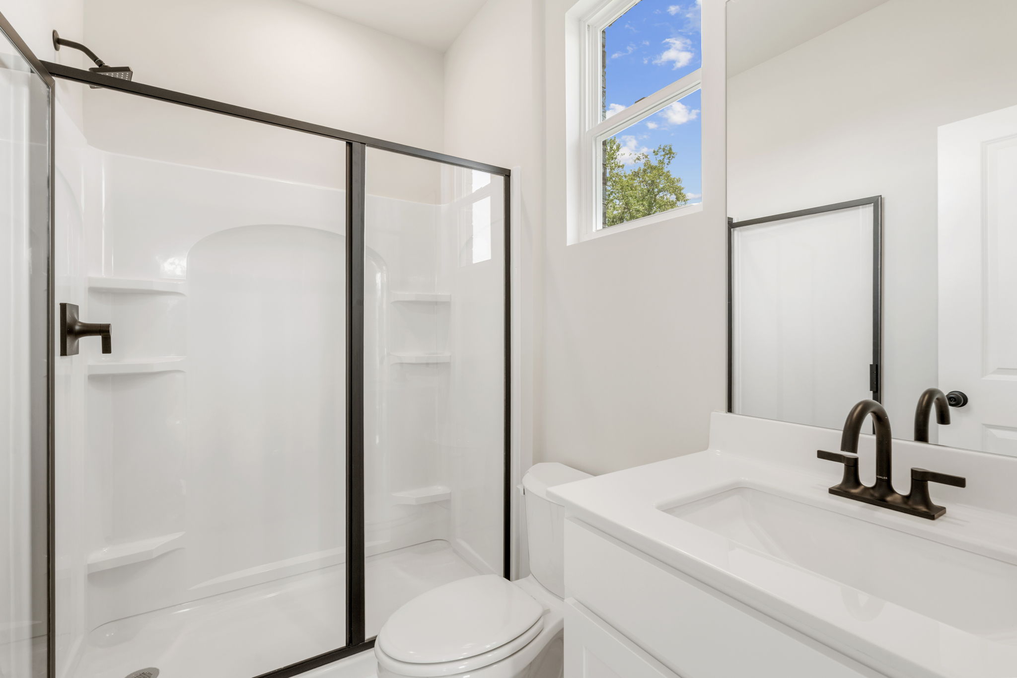A bathroom with a glass shower.