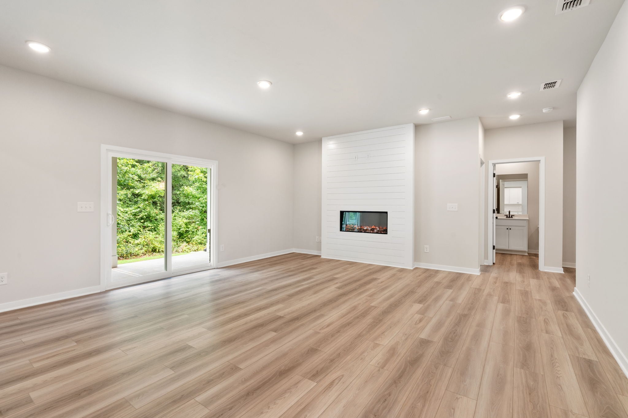 A room with a wood floor and a wood floor.