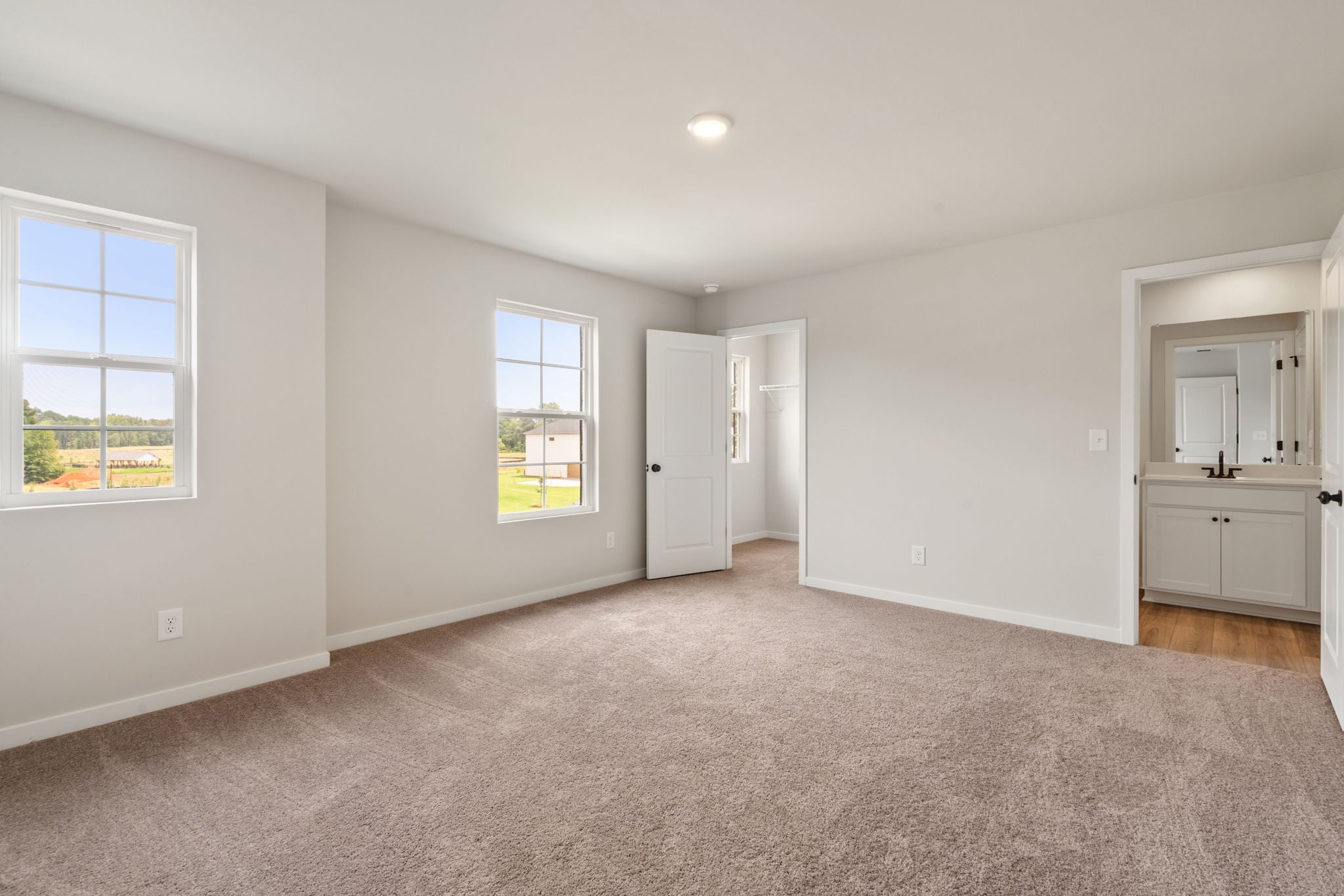 A large empty room with white walls.