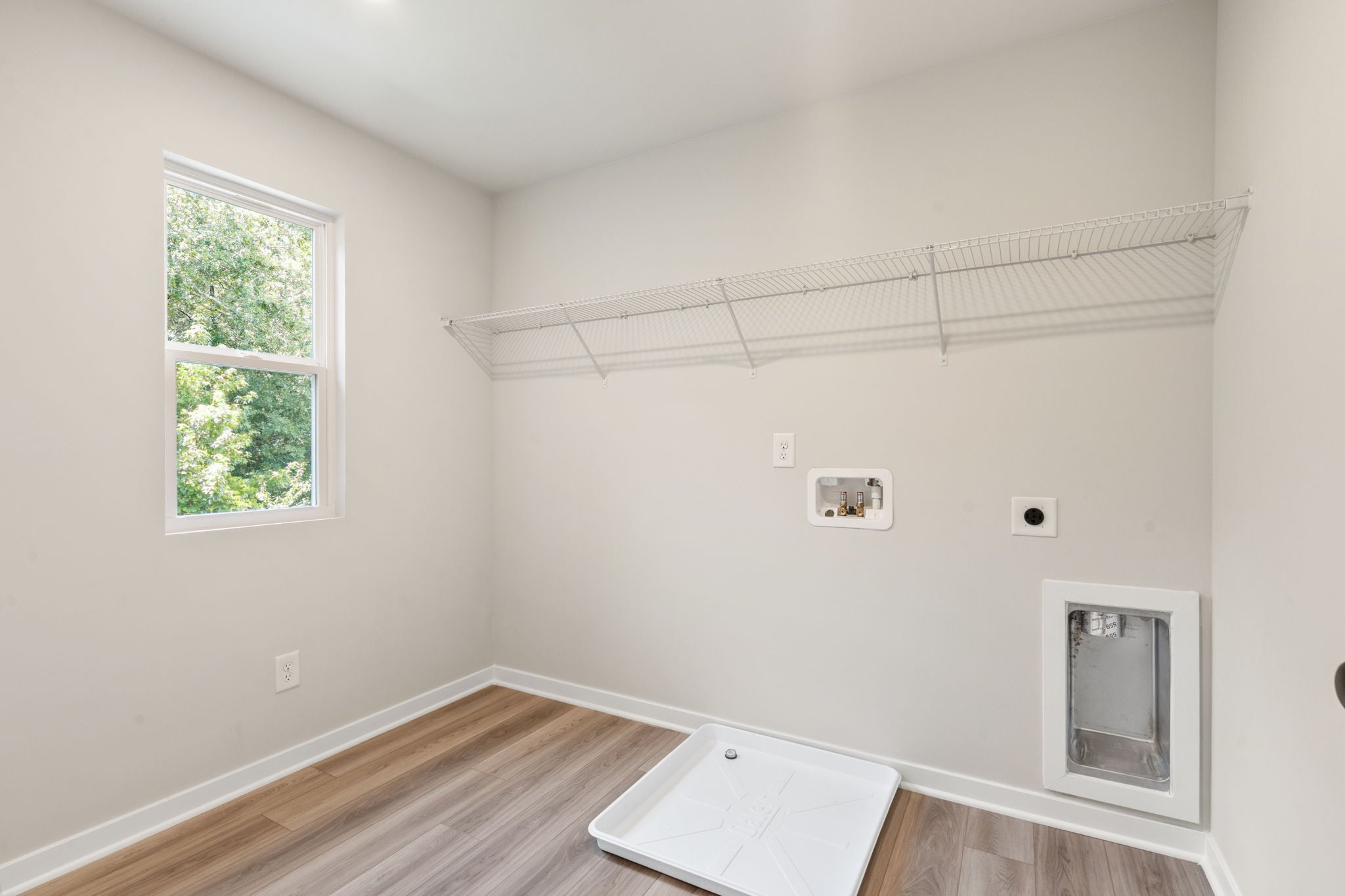A room with a table and a window.