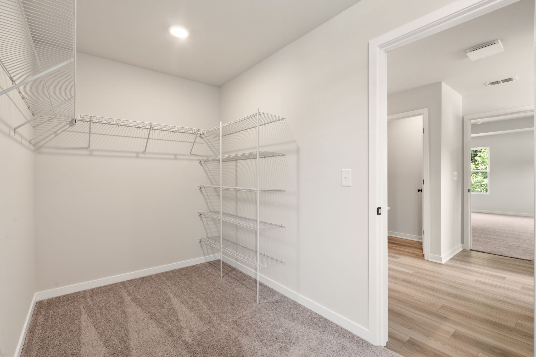 A room with a ladder and a door.