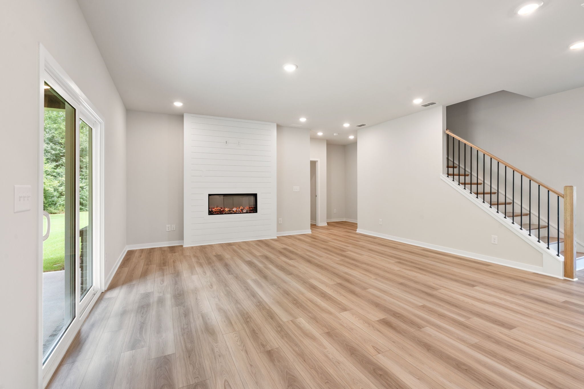 A room with a wood floor and a wood floor.