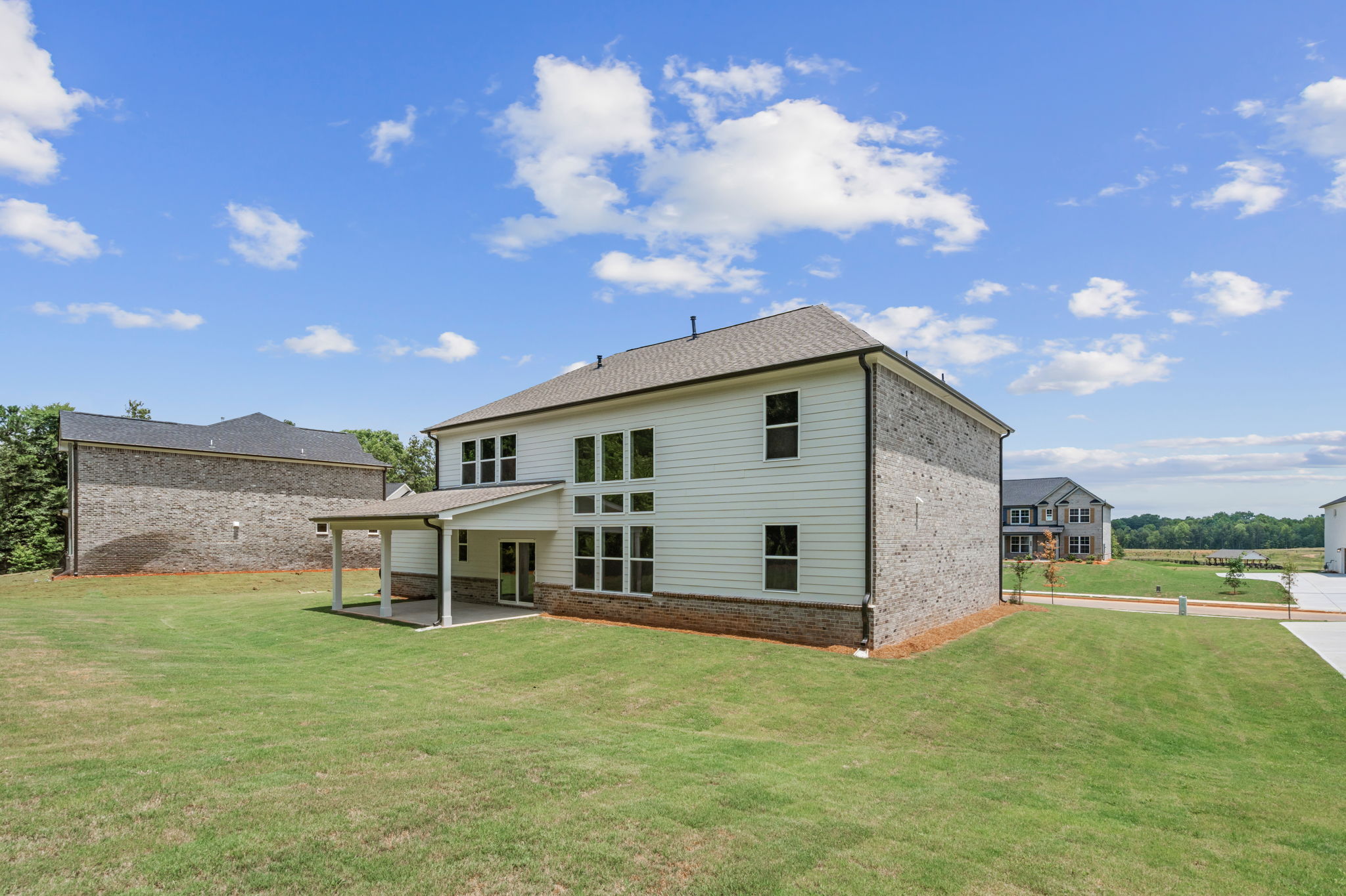 A house with a grass yard.
