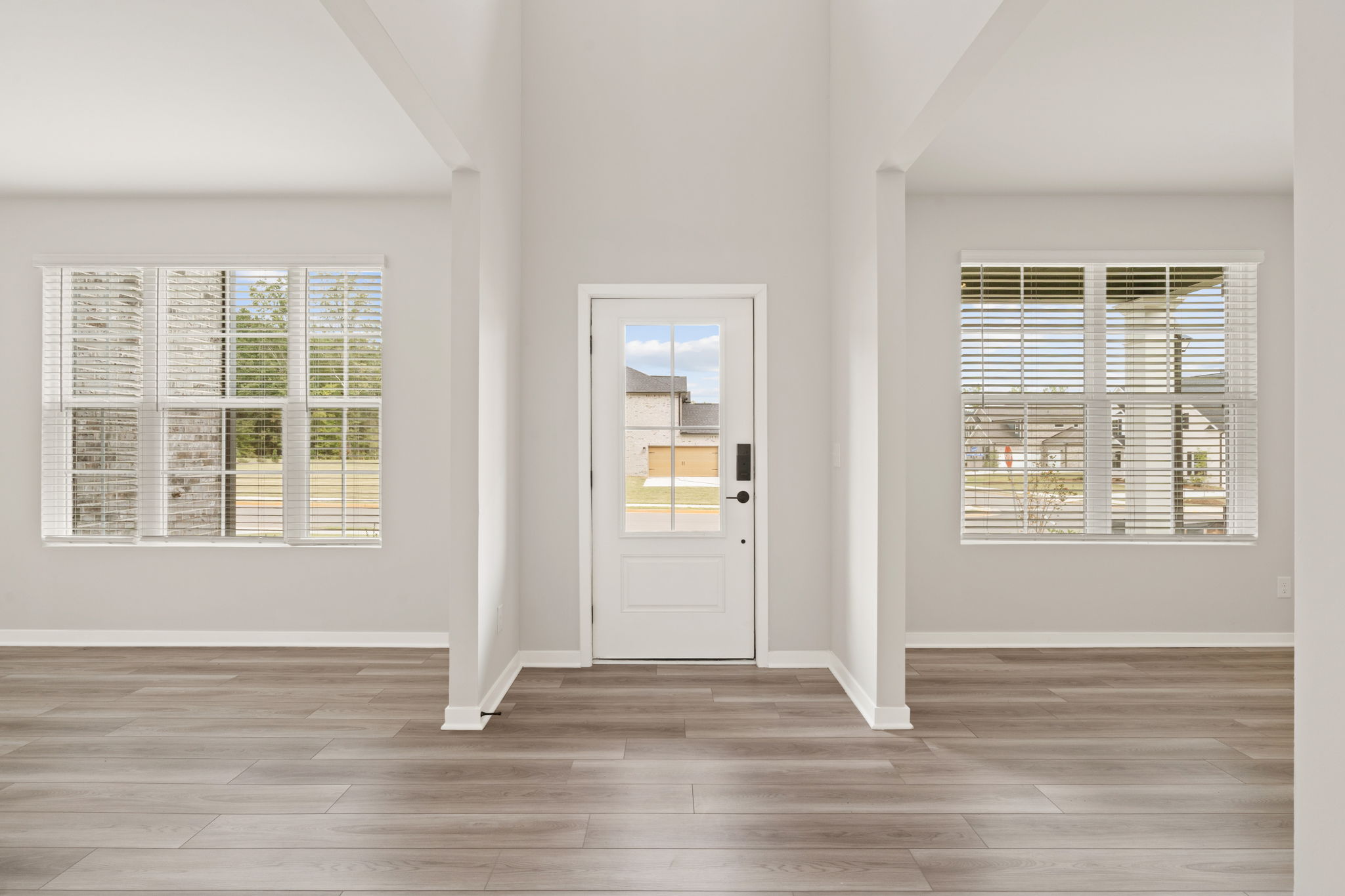 A room with a door and windows.