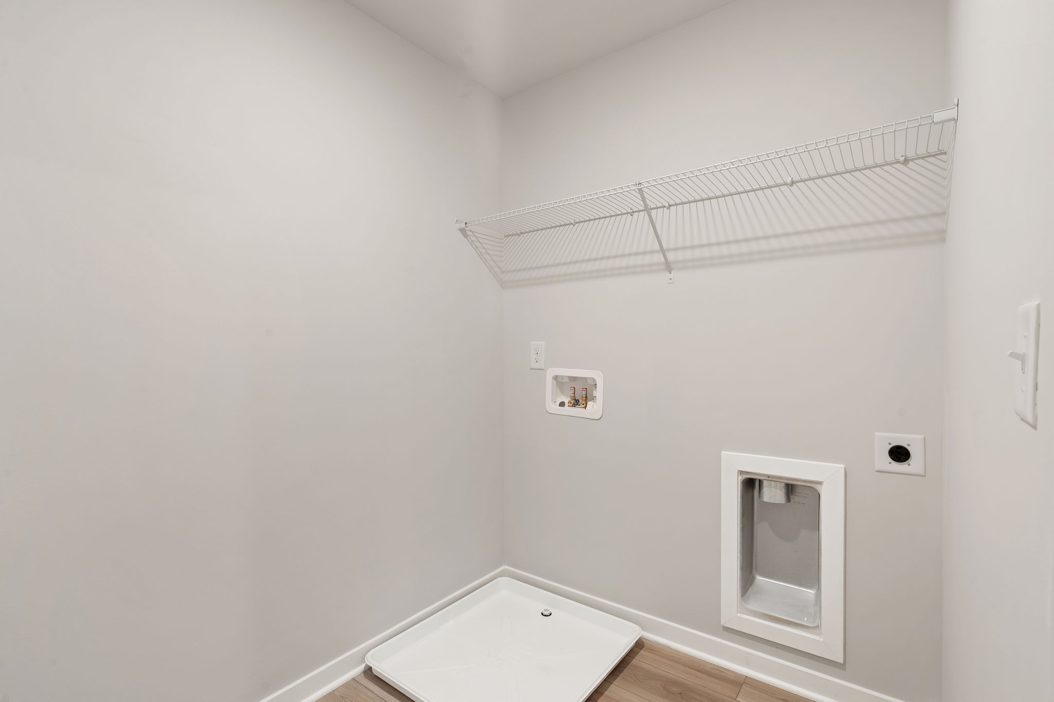 A white room with a vent.